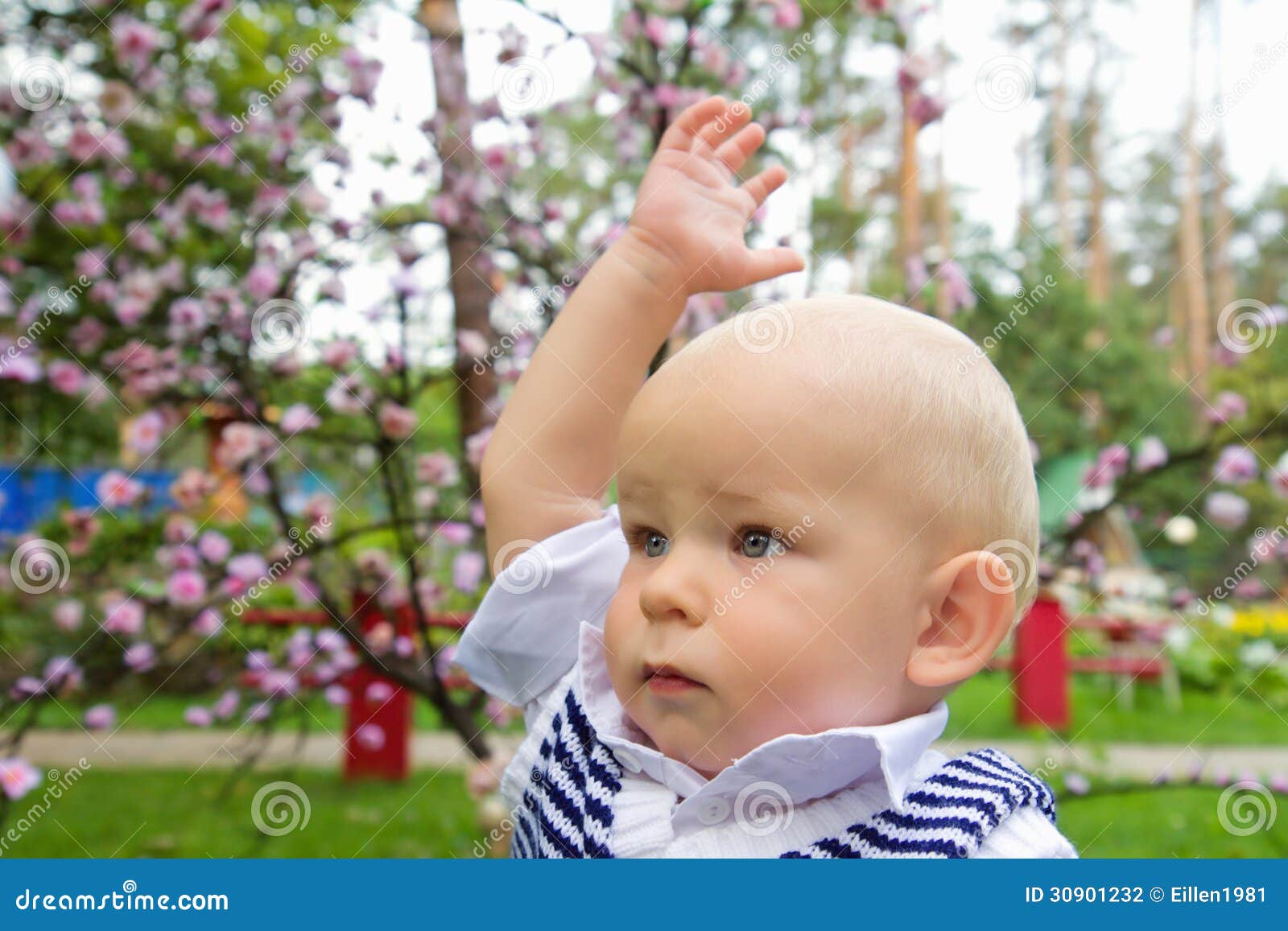 little-boy-raising-his-hand-up-serious-summer-park-30901232.jpg