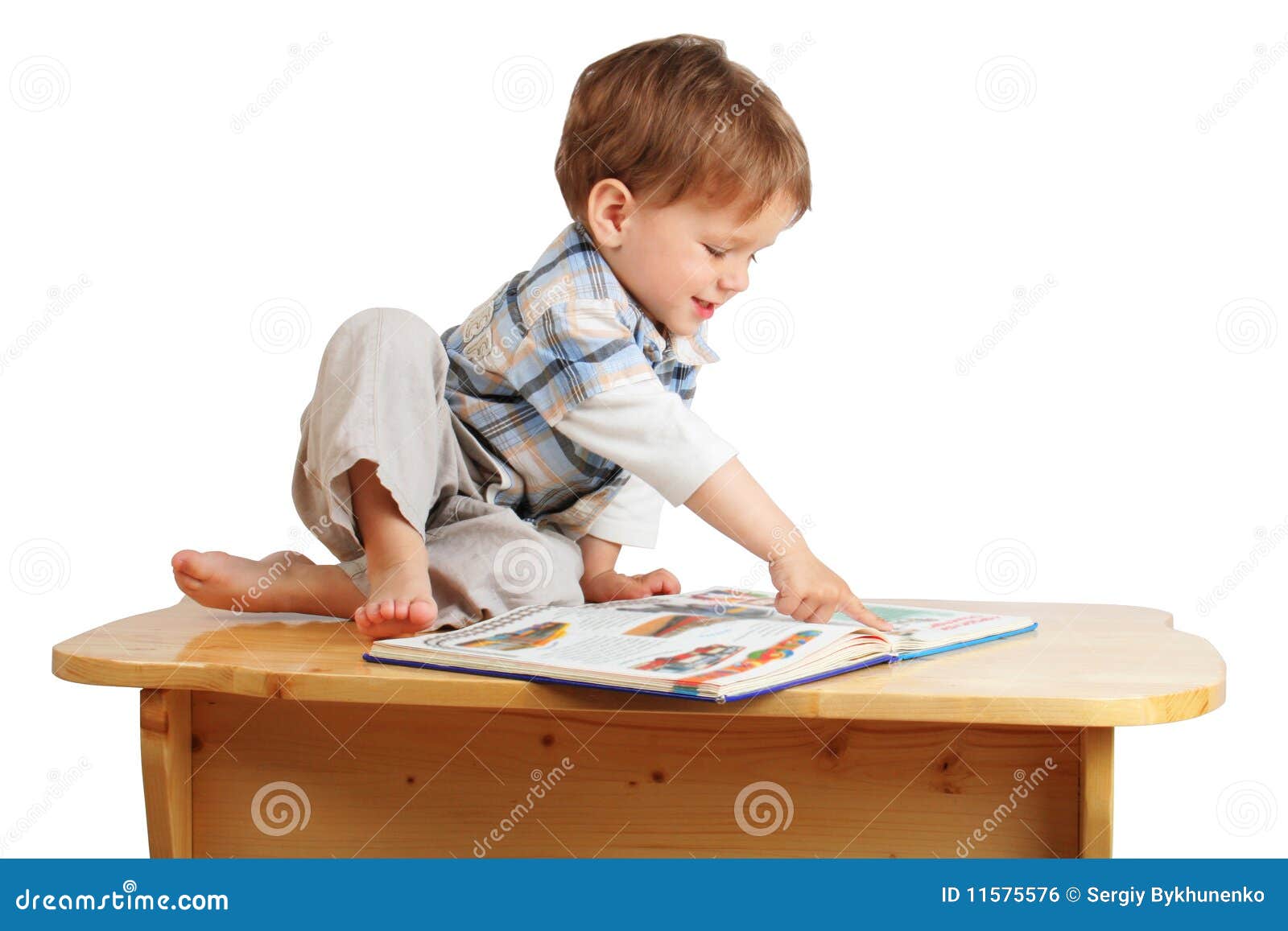 Little Boy Reading The Book On The Desk Royalty Free Stock ...