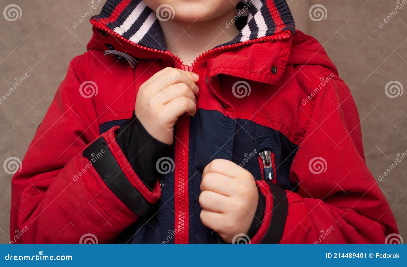Little boy in a red jacket stock image. Image of lifestyle 214489401