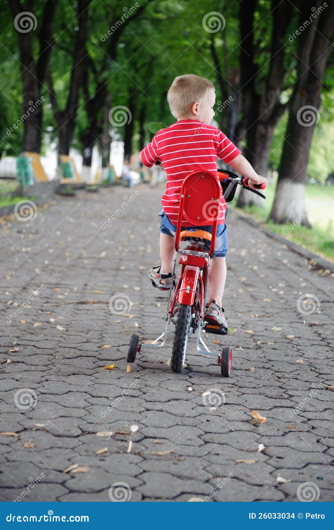 little boy riding bike
