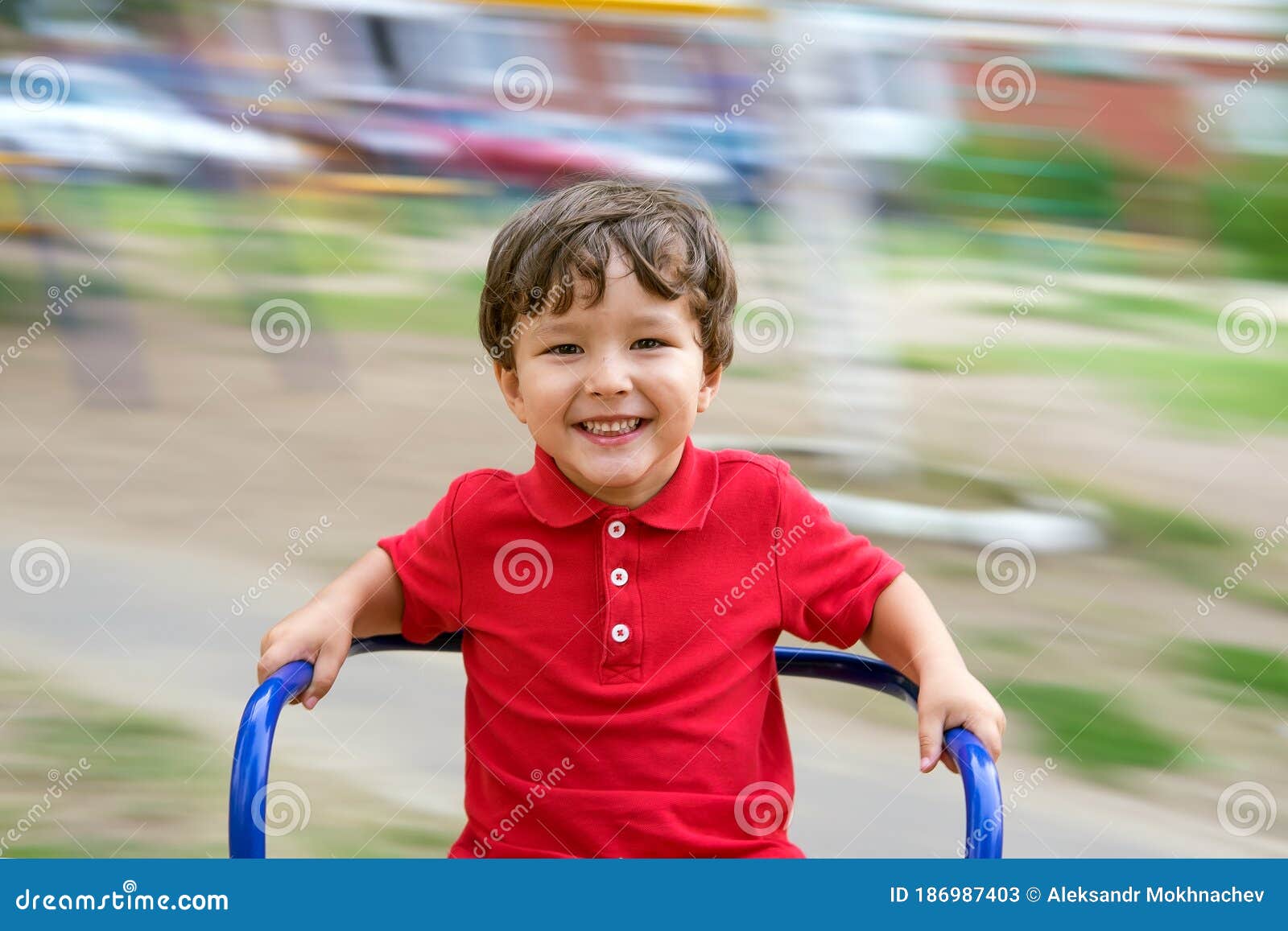 little boy riding a swing