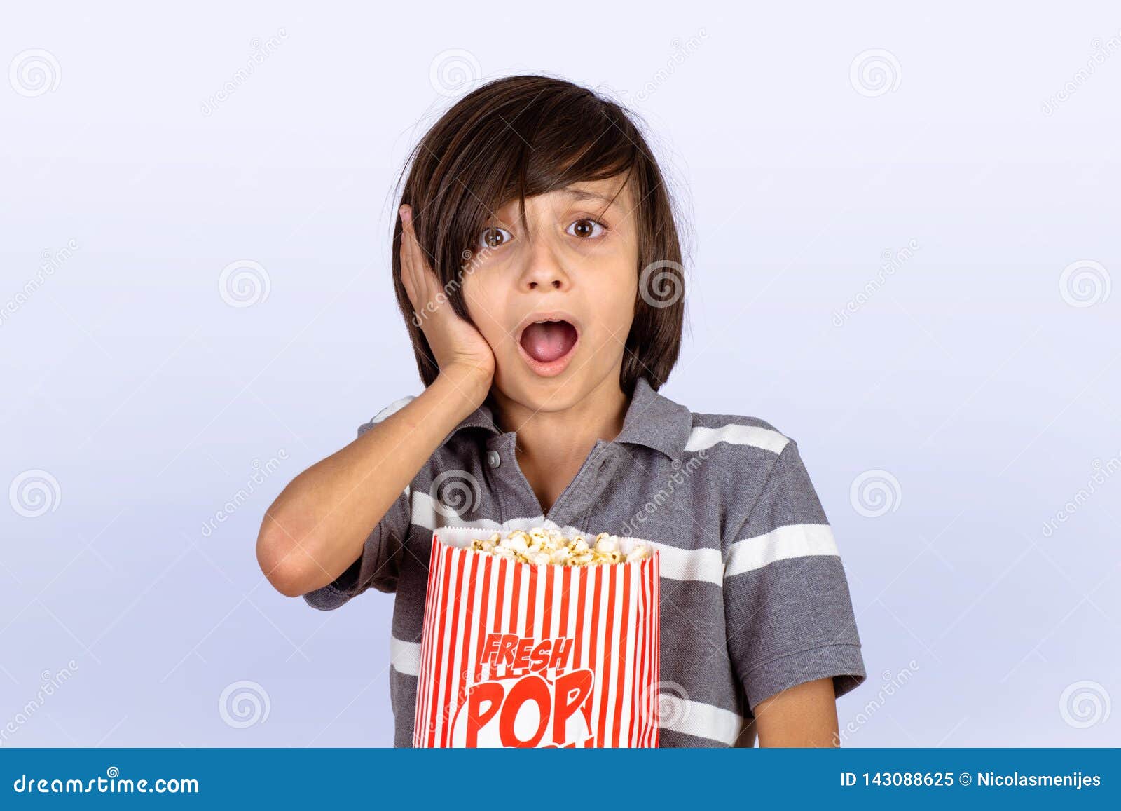 Little Boy with Shock Expression and Popcorn Stock Image Image of