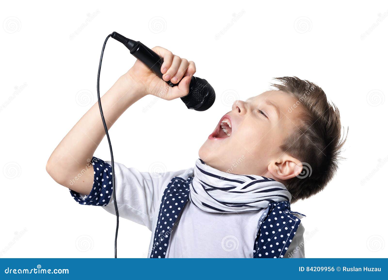 little boy sing song in microphone