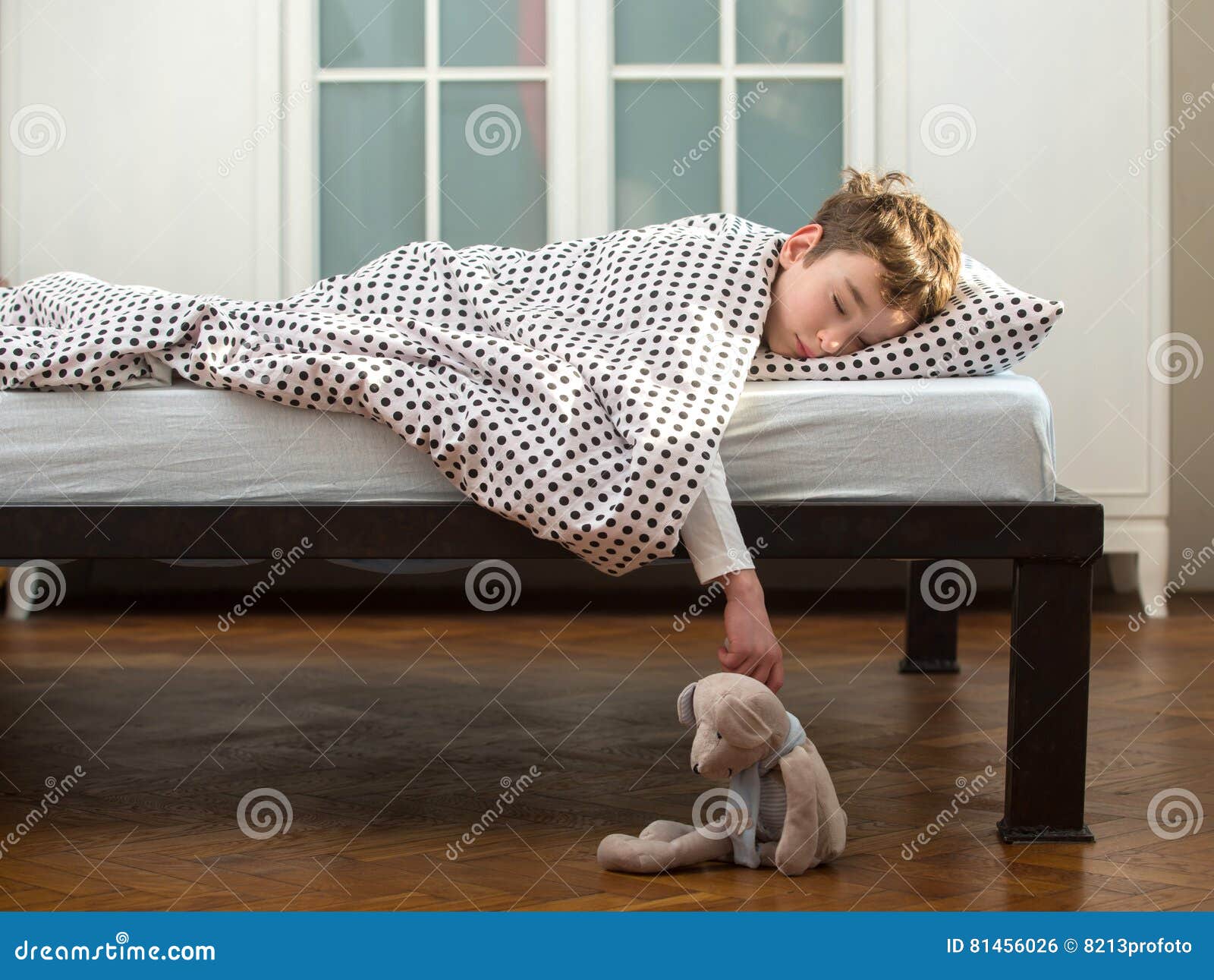Little boy sleeping in bed stock photo. Image of lifestyle 81456026