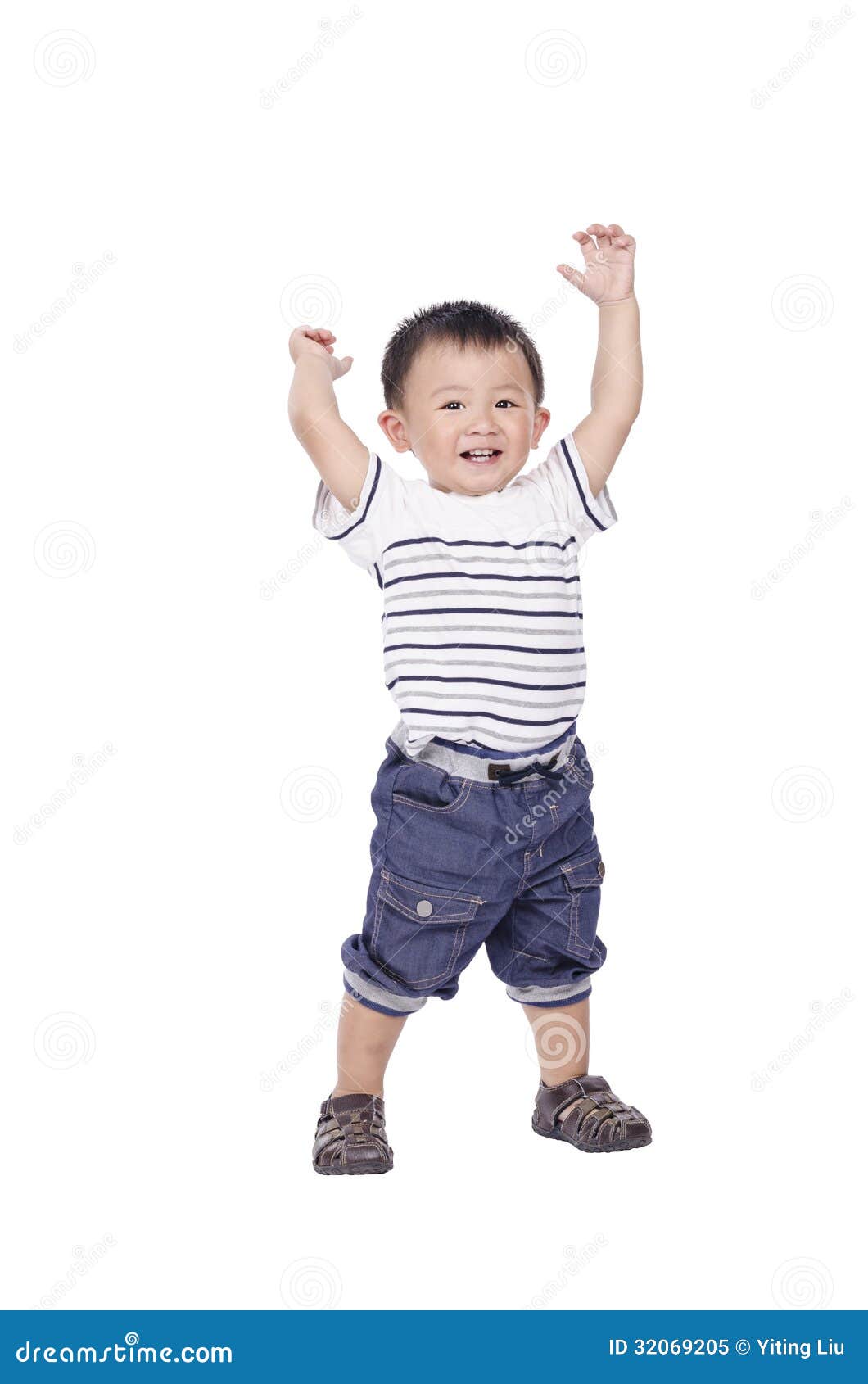 Little boy stand and raise hands up on white background