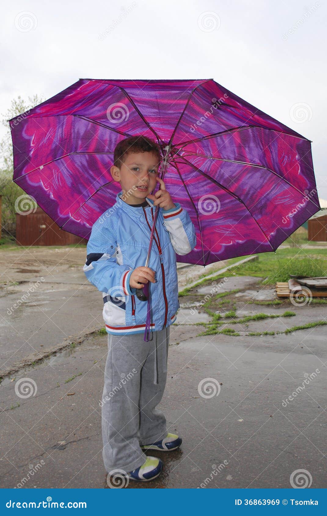 Little Boy Standing Under an Umbrella in the Spring Stock Image Image