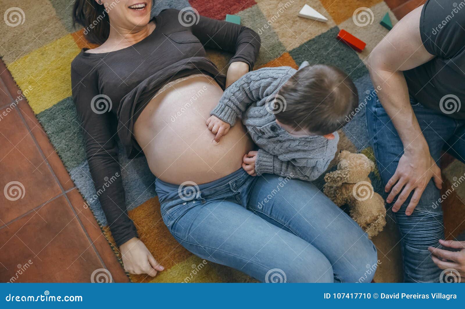 Male belly button tickle