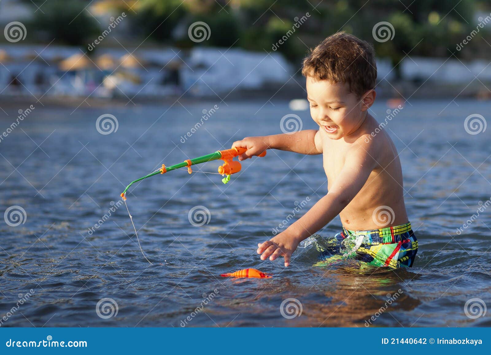 Little Boy and Toy Fishing Pole Stock Photo - Image of water