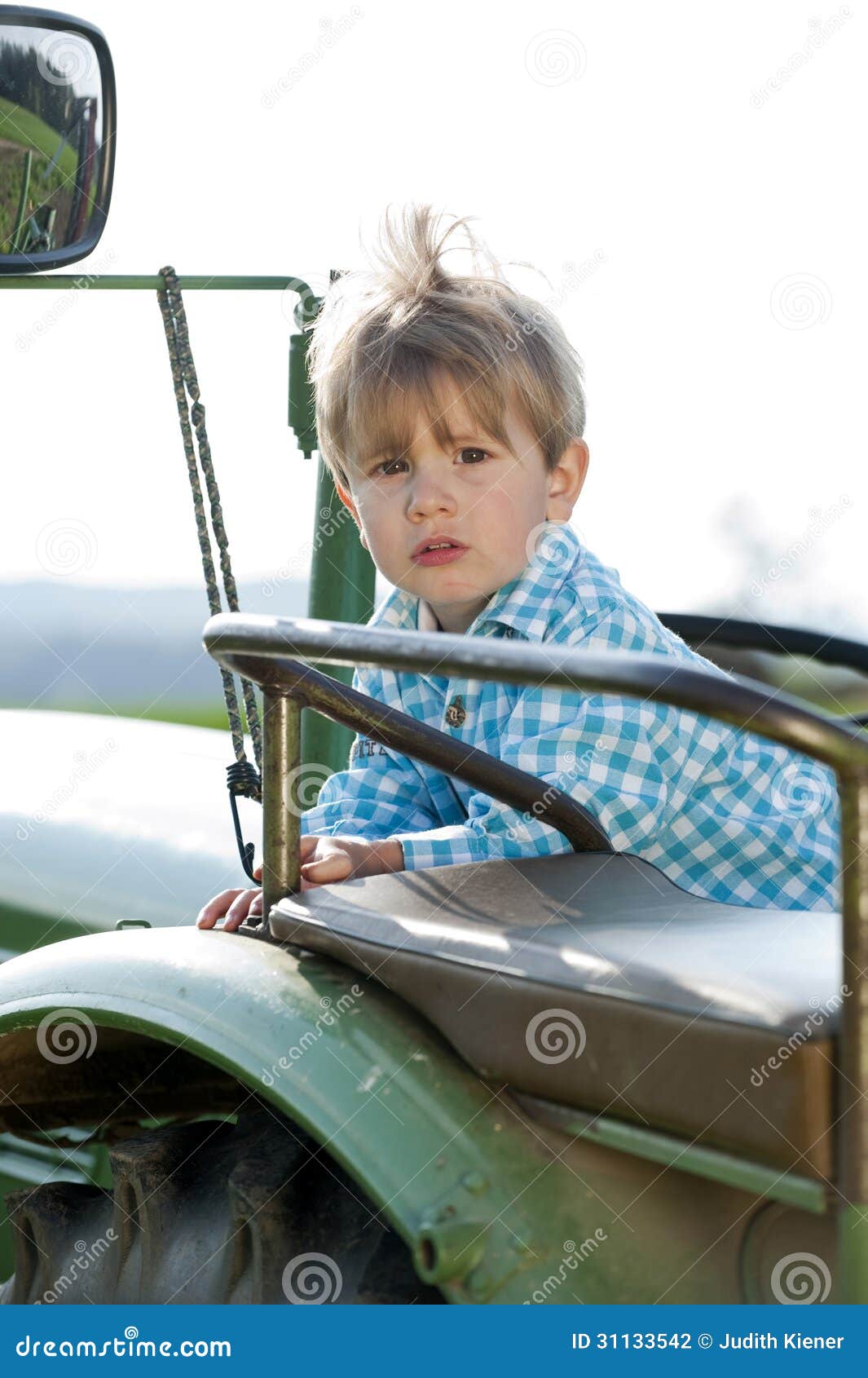Little boy on a tractor stock photo. Image of flowers 31133542
