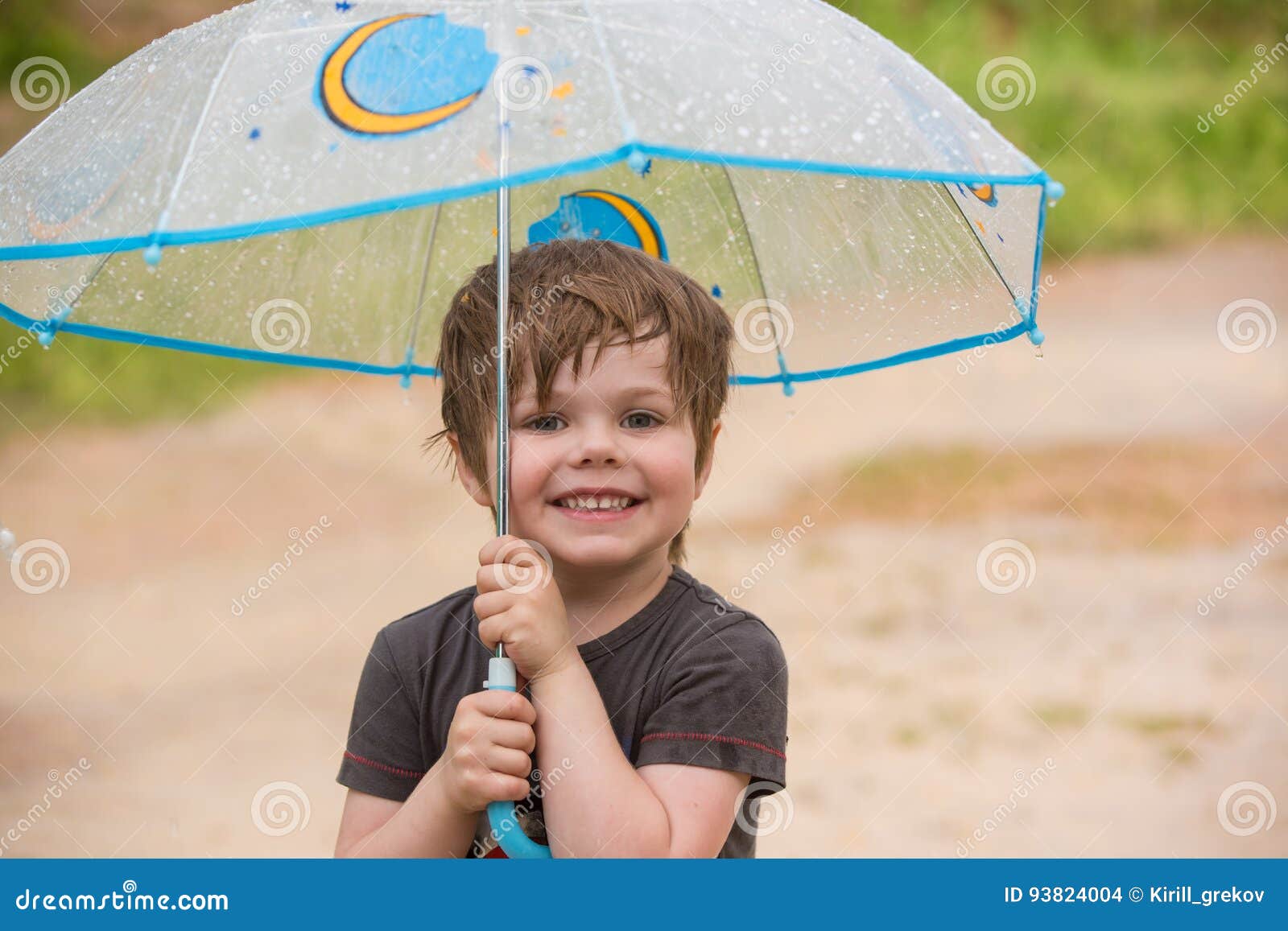 Little boy under umbrella stock photo. Image of nature 93824004