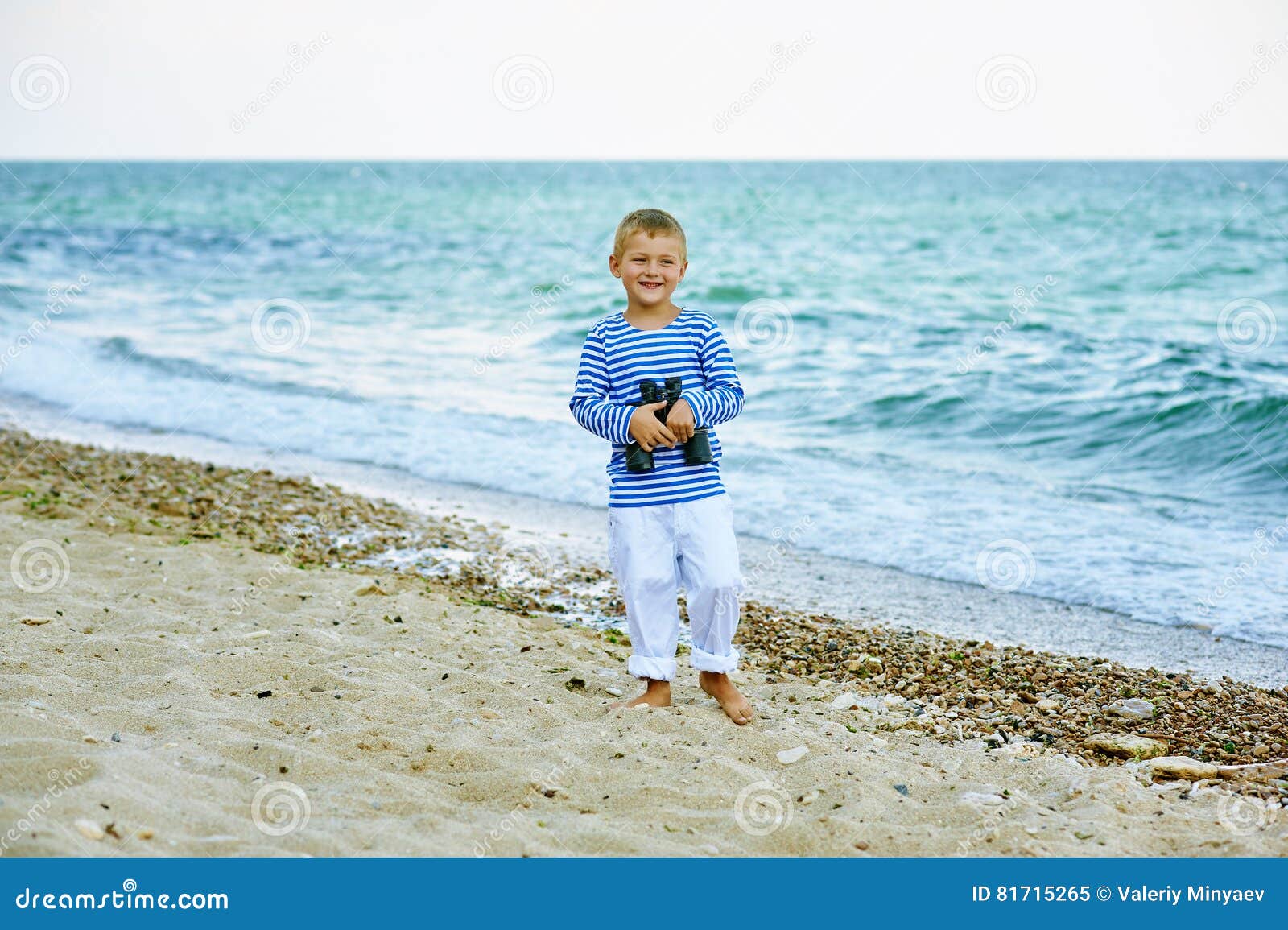 The Little Boy in the Vest with Binoculars , Walking the Coast Stock