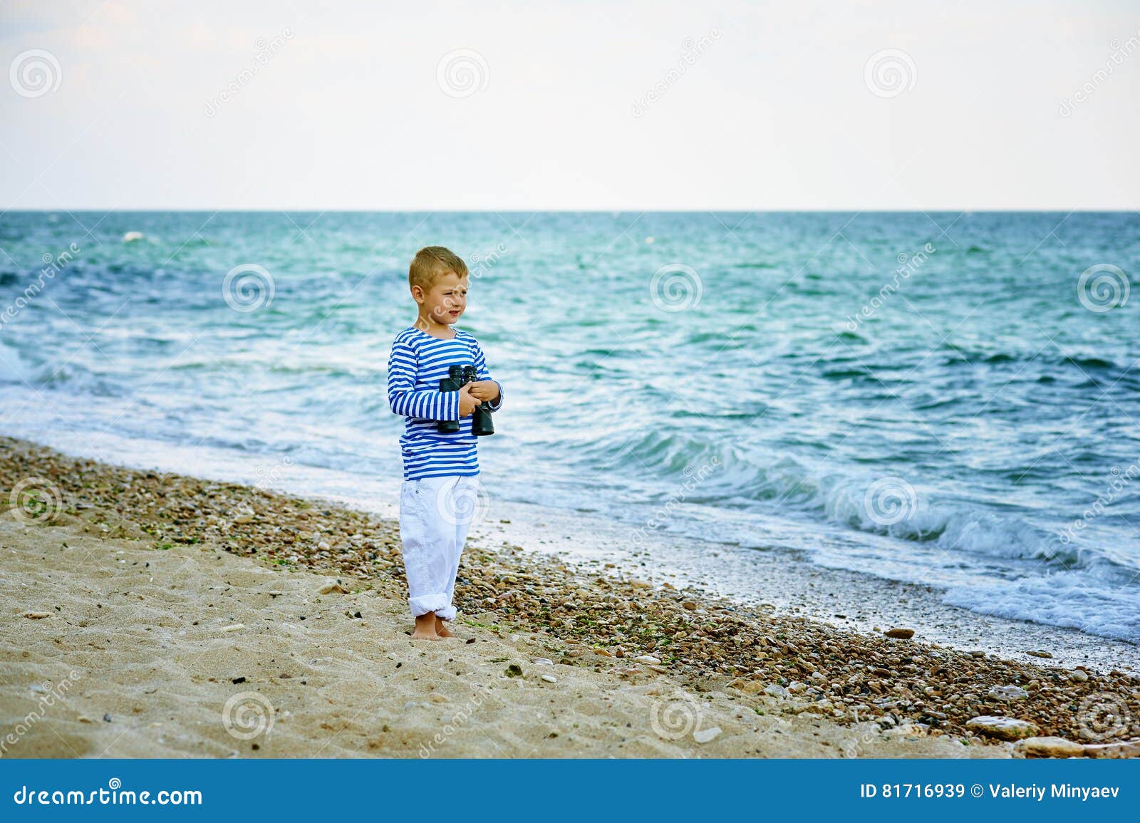 The Little Boy in the Vest with Binoculars , Walking the Coast Stock