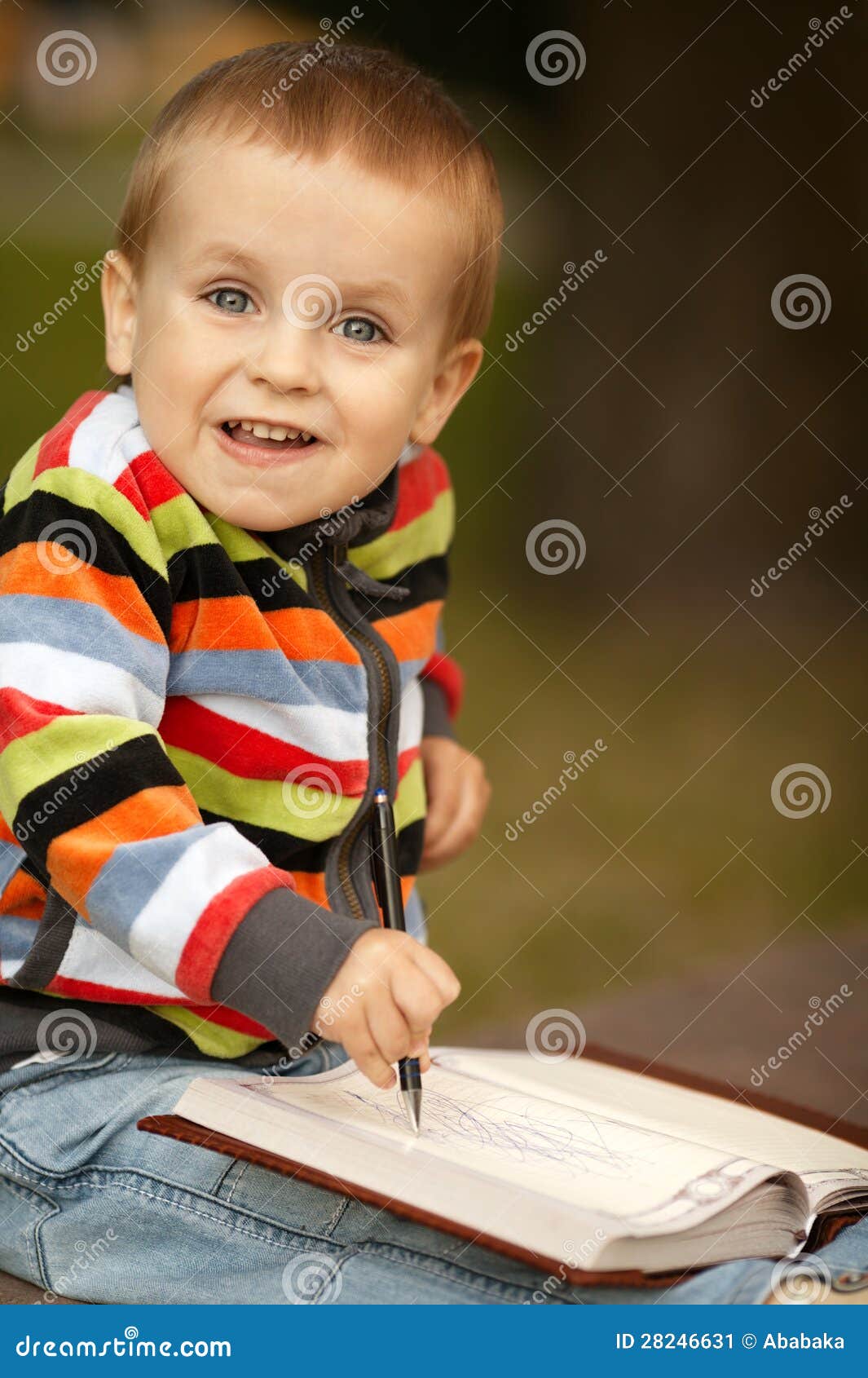 Little boy writes with pen stock image. Image of notepad 28246631