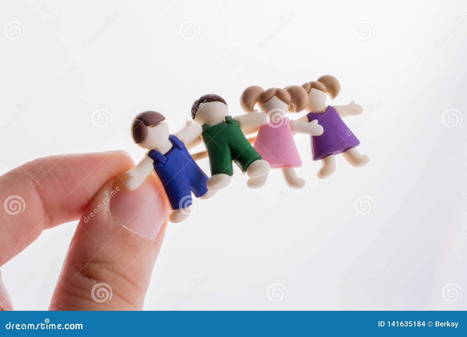 Little Boys and Girls Kid Figurines in Hand Stock Photo - Image of team ...