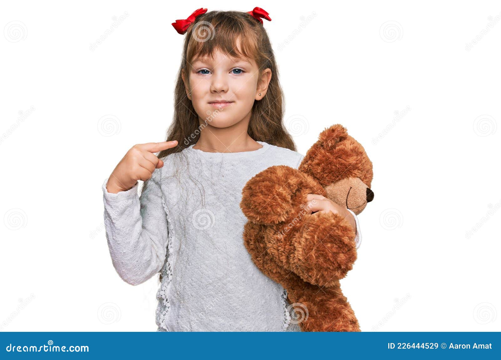 Little Caucasian Girl Kid Hugging Teddy Bear Stuffed Animal Pointing ...