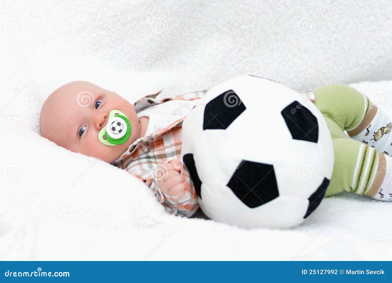little chap with soccer ball on white background