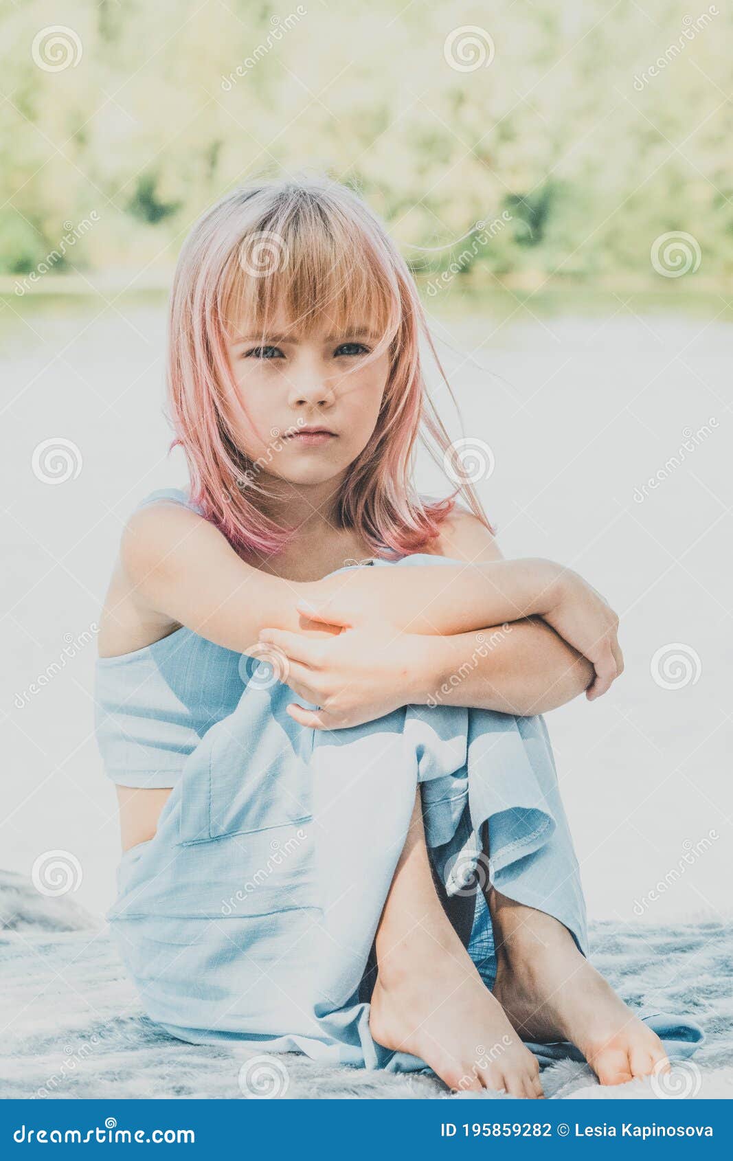 Little Charming Girl Sitting Near the River. Little Girl Near the River ...