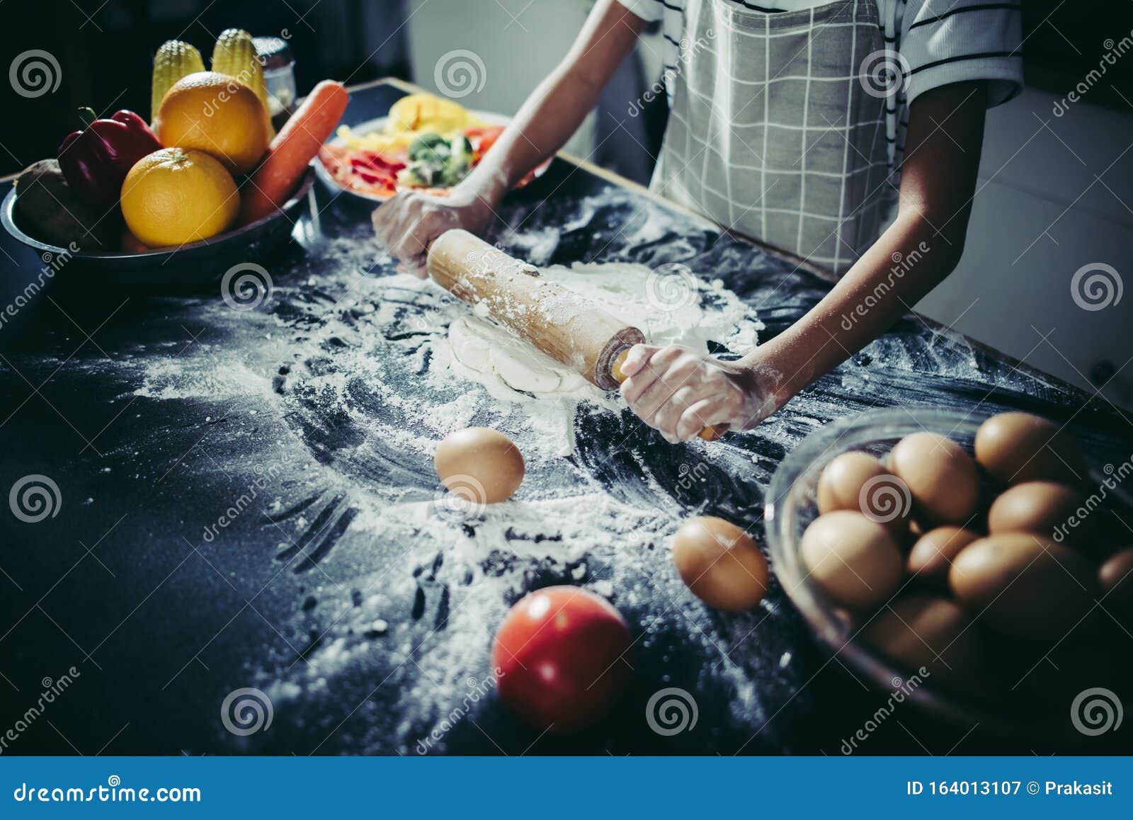 Little Chef Using Rolling Pin Stretching the Dough. Stock Image Image
