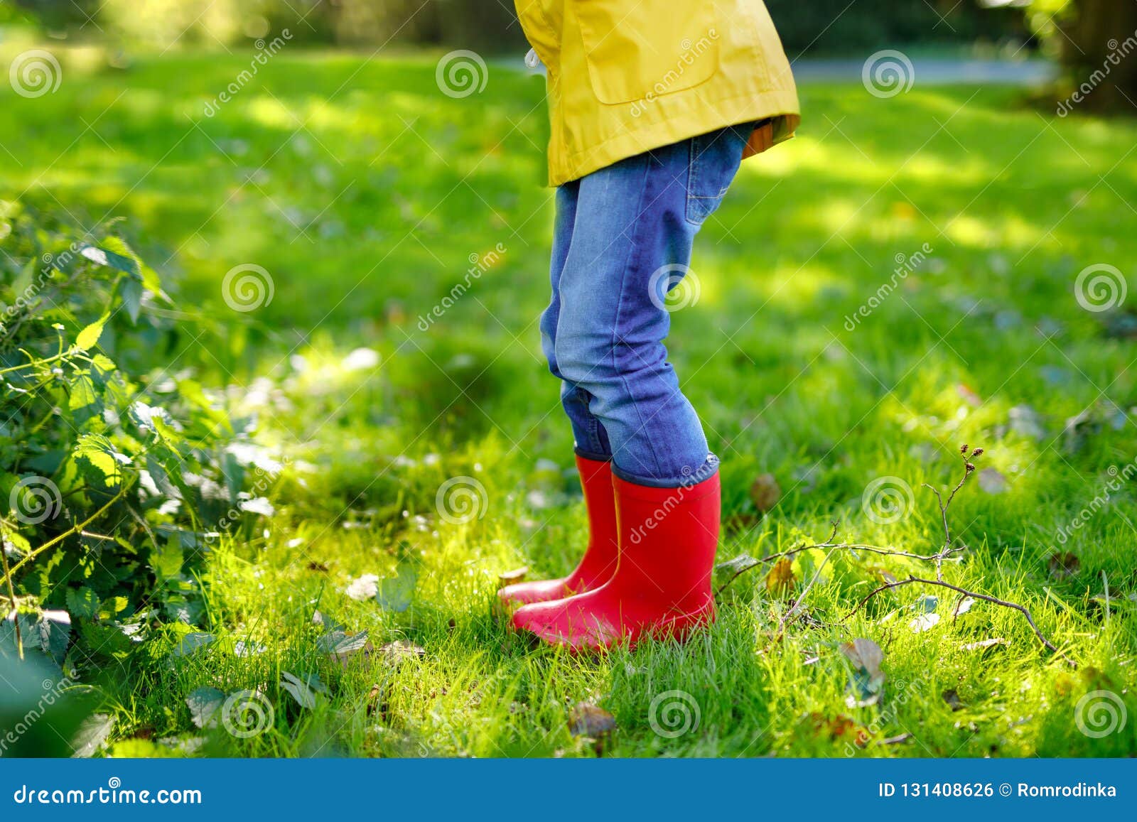 Little Child In Colorful Rain Boots 