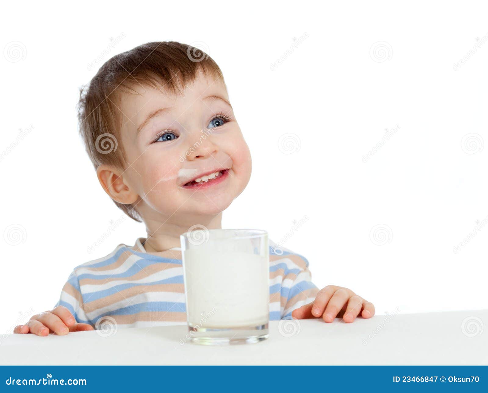 little child drinking yogurt or kefir over white