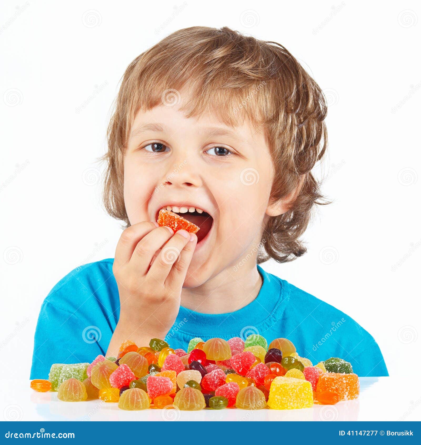 Little Child Eating Candies on White Background Stock Image Image of