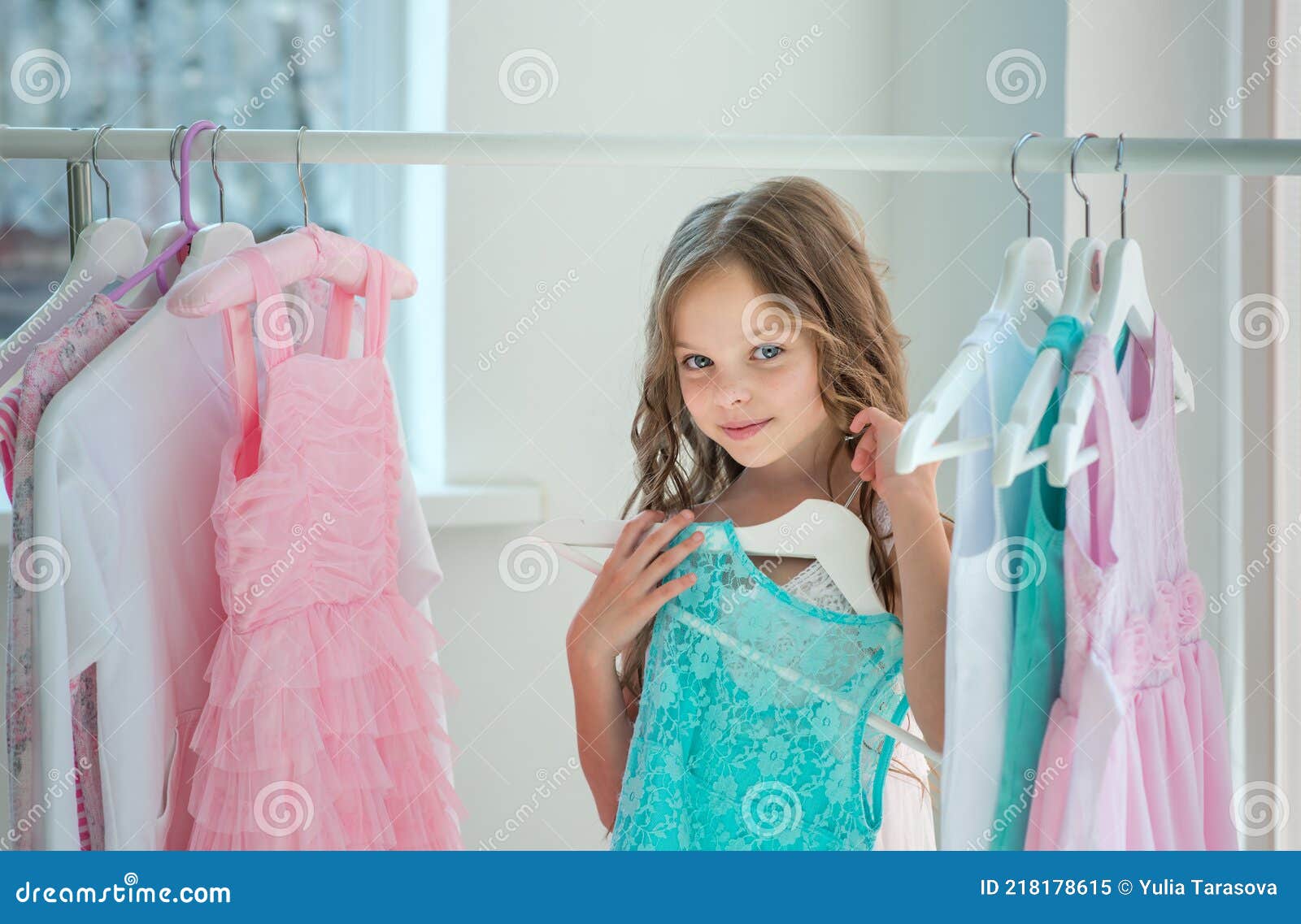 https://thumbs.dreamstime.com/z/little-child-girl-choosing-her-clothes-kid-thinking-what-to-choose-wear-front-many-choices-dresses-hangers-sales-buy-218178615.jpg