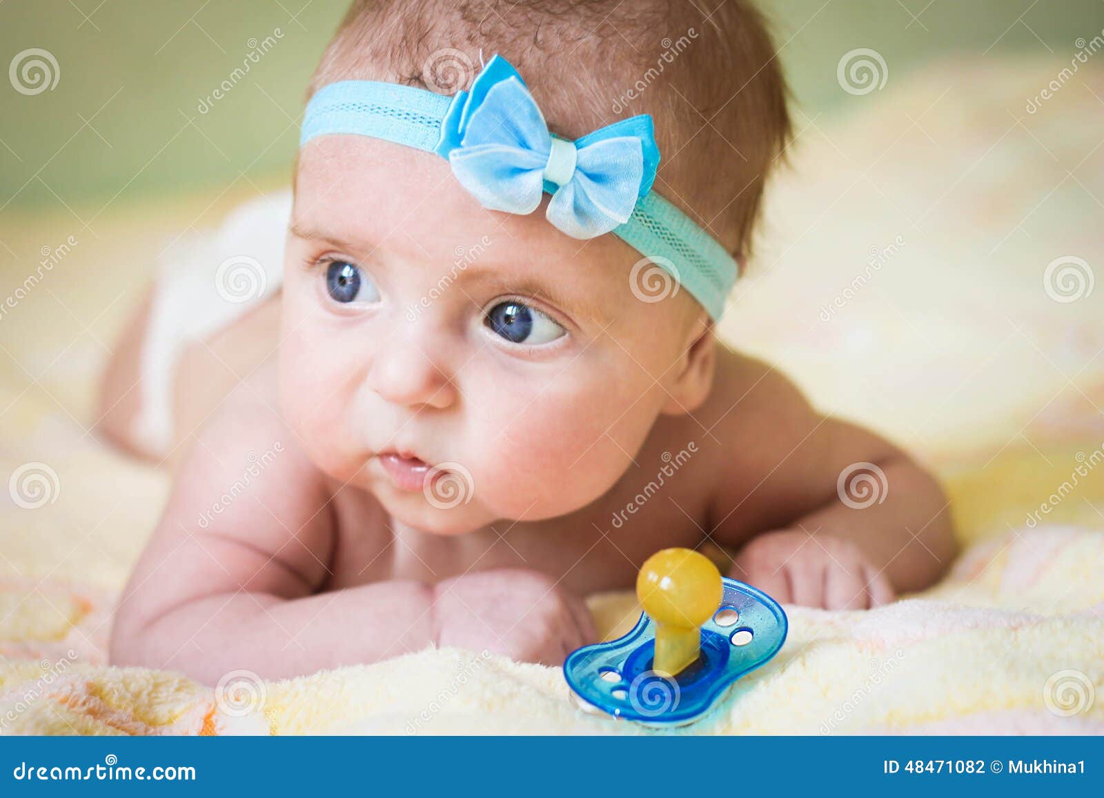 A Little Child Holds a Pacifier in His Hand Stock Photo Image of
