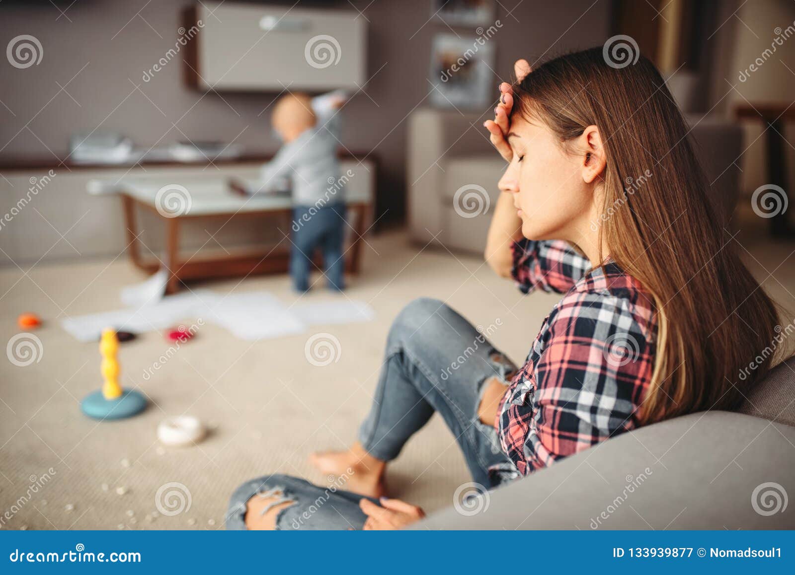 little child playing in room, mother in stress