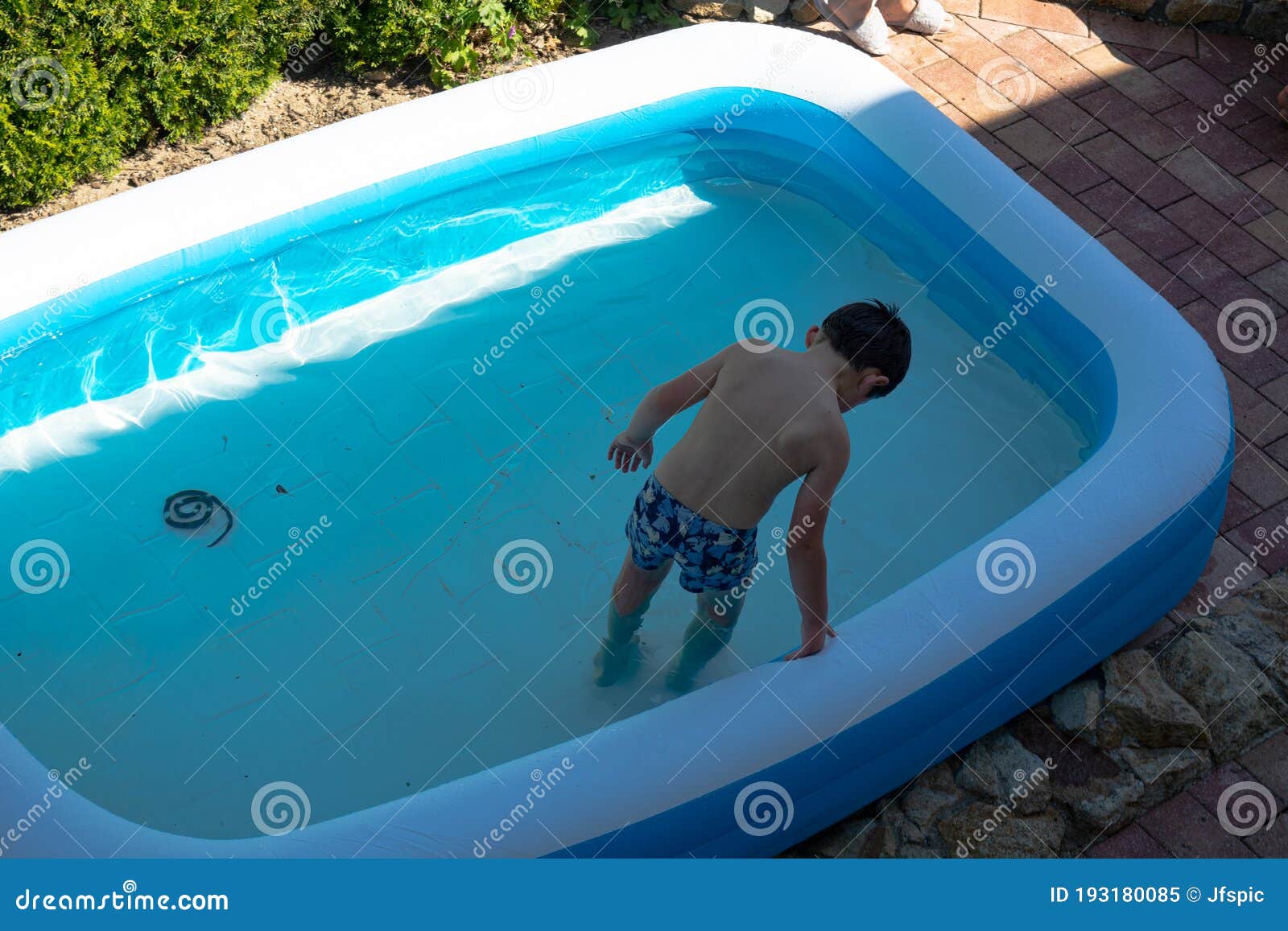 little child swimming in pool