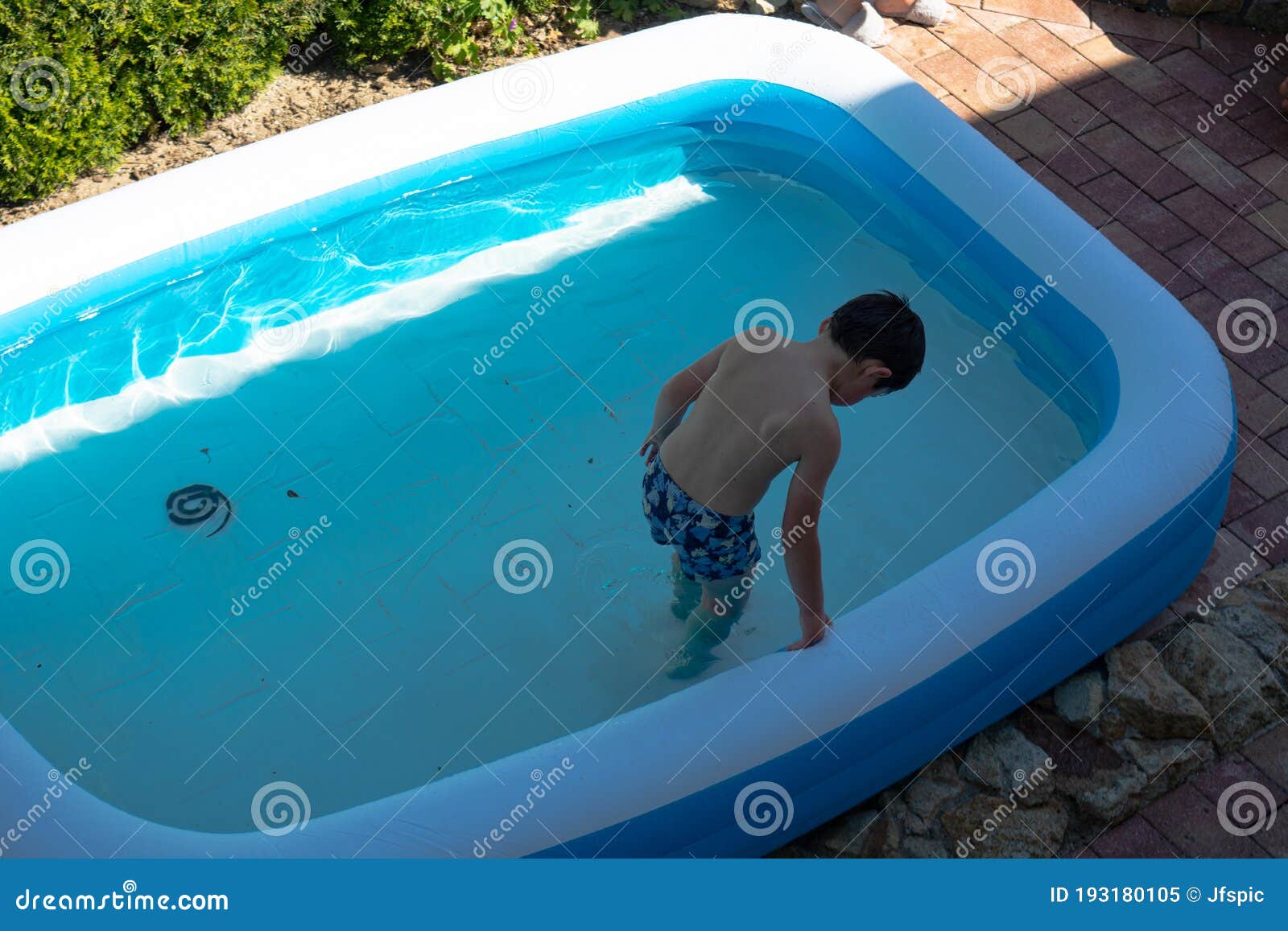 little child swimming in pool