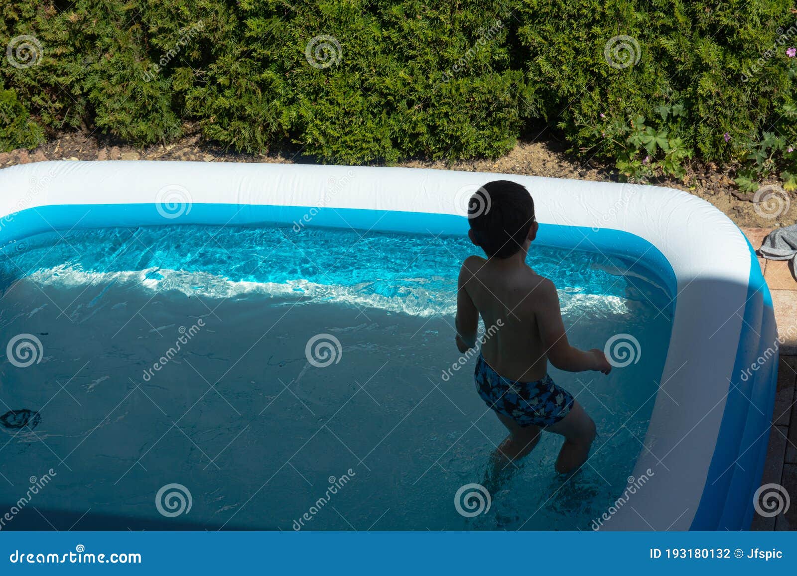 little child swimming in pool