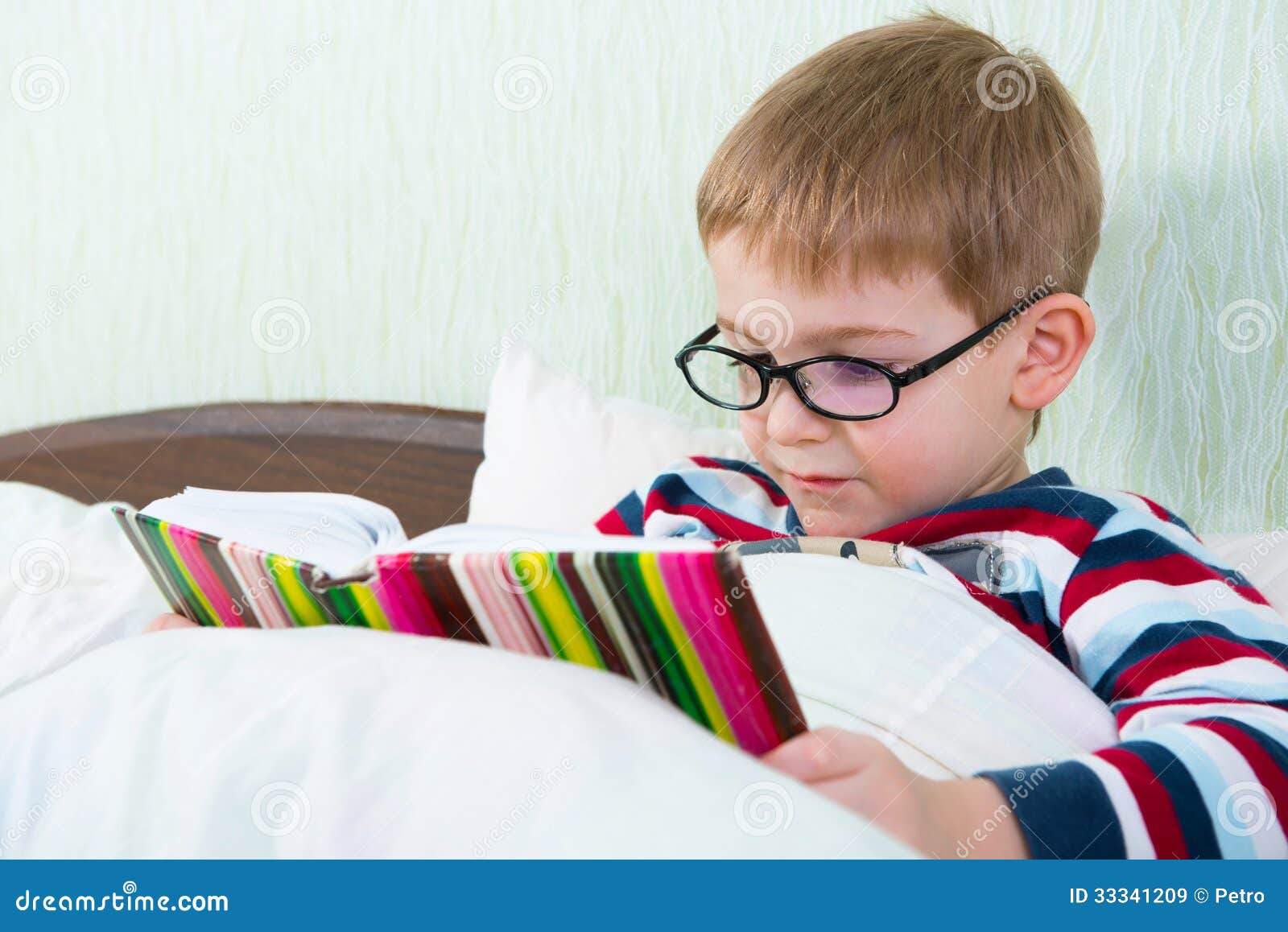 Little Cute Boy Reading Book in Bed Stock Image Image of hair, home