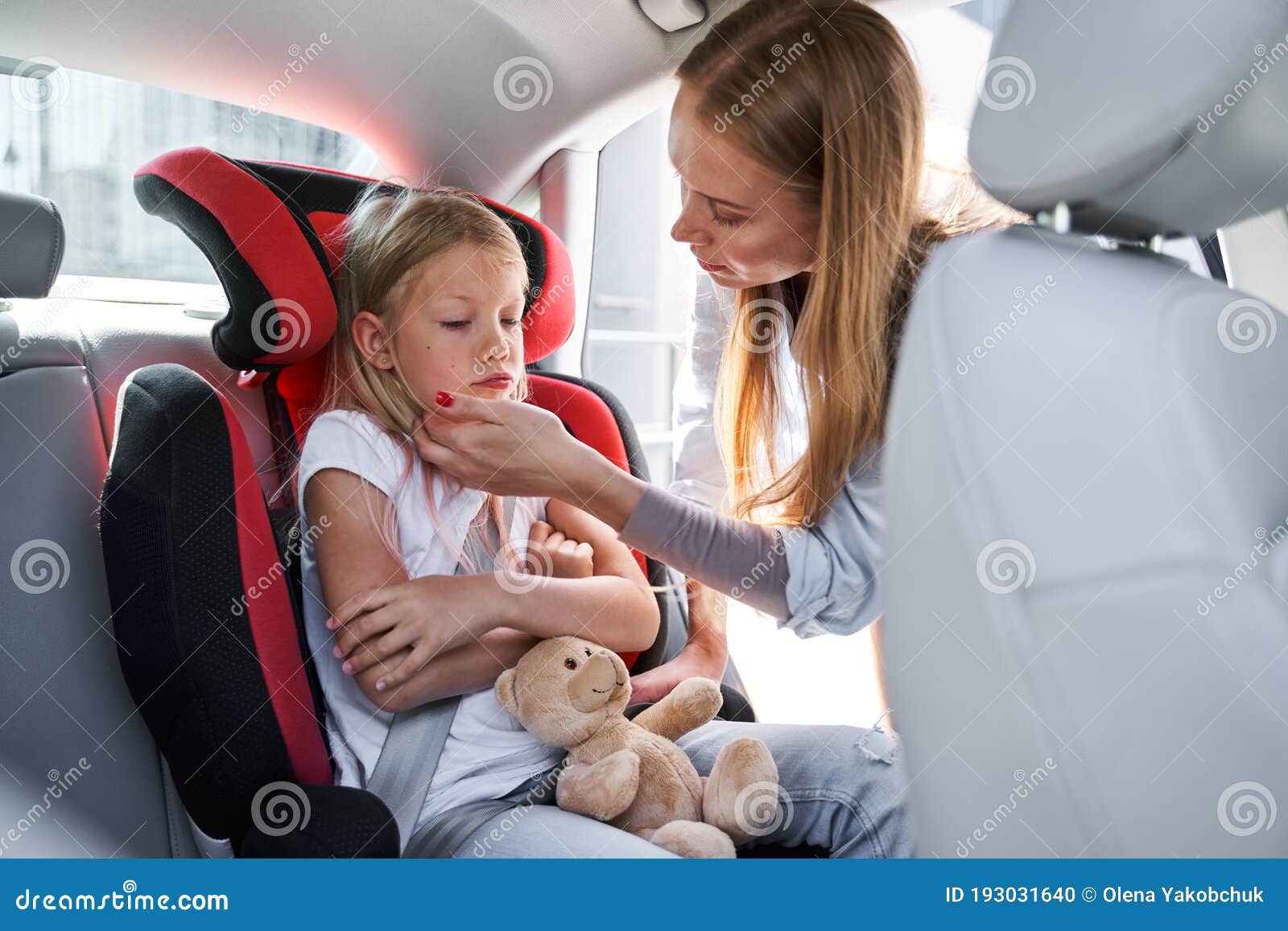 Mother Taking Care of Child in Car Stock Photo - Image of embrace,  insurance: 193031640