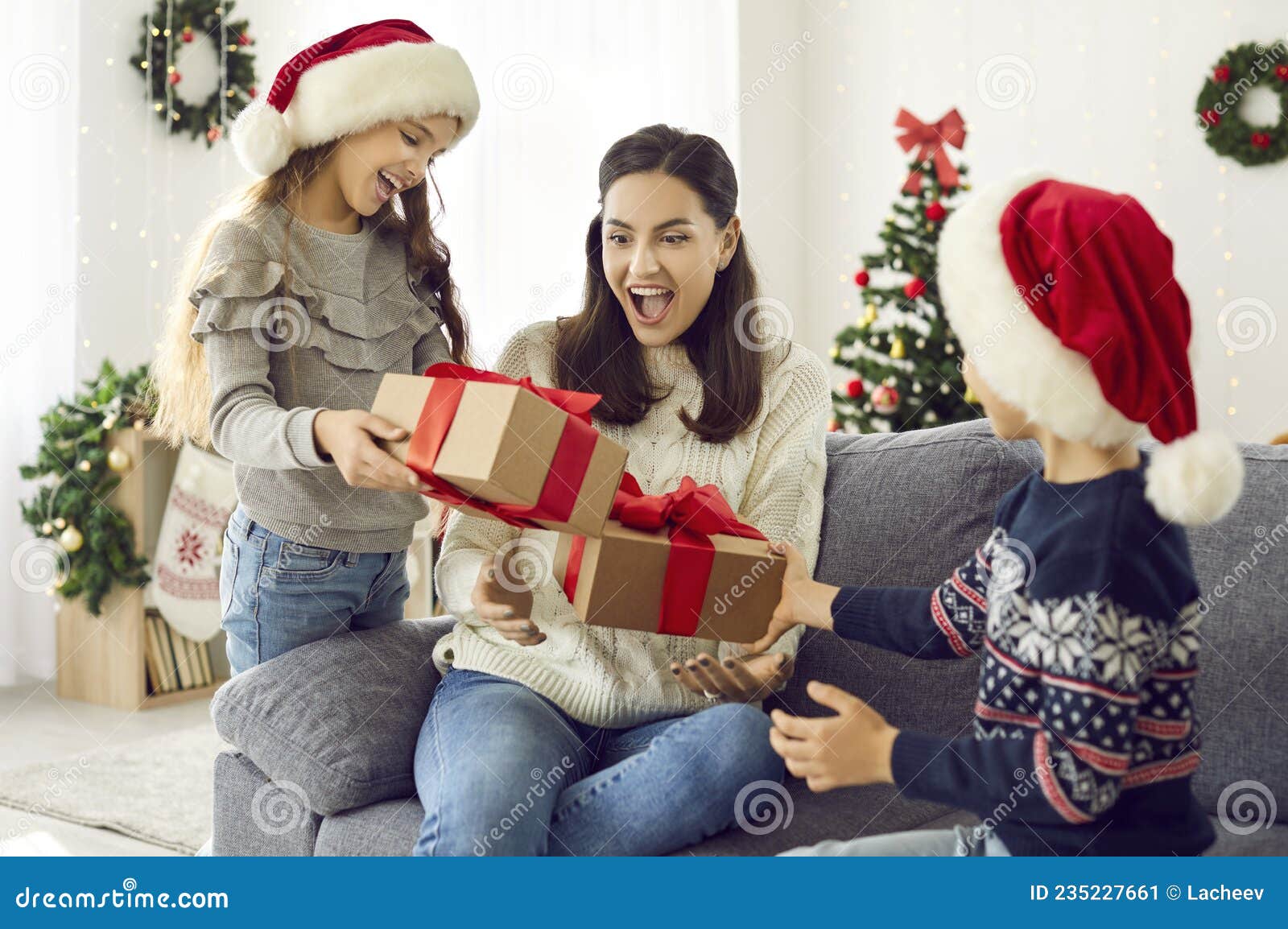 https://thumbs.dreamstime.com/z/little-daughter-son-prepare-xmas-surprise-their-mother-christmas-day-happy-family-enjoying-gift-giving-christmas-235227661.jpg