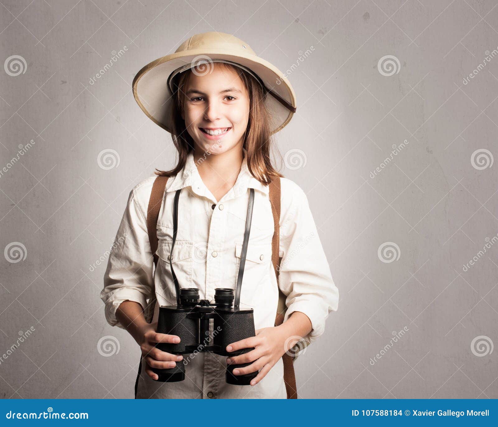 little explorer holding binoculars