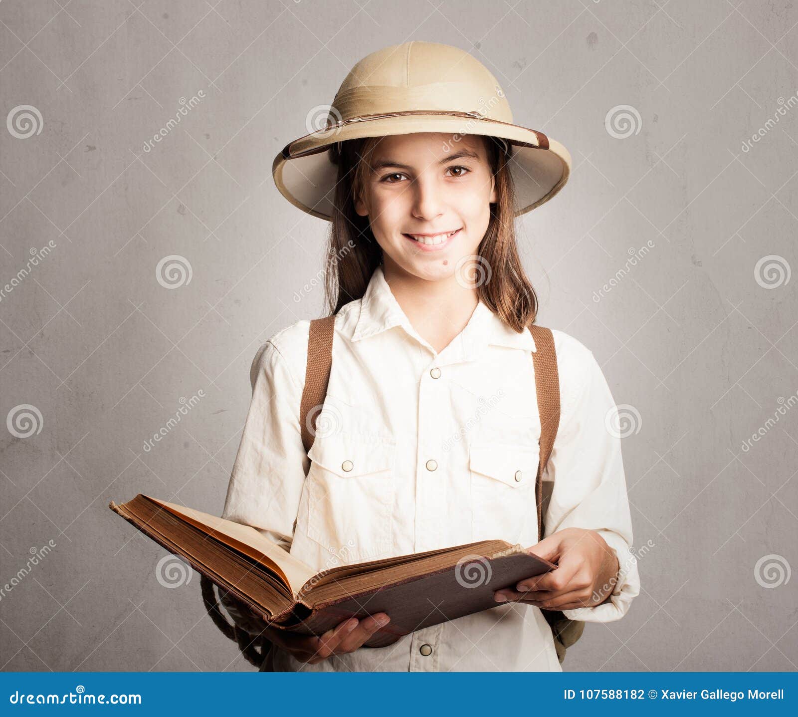 little explorer reading a book