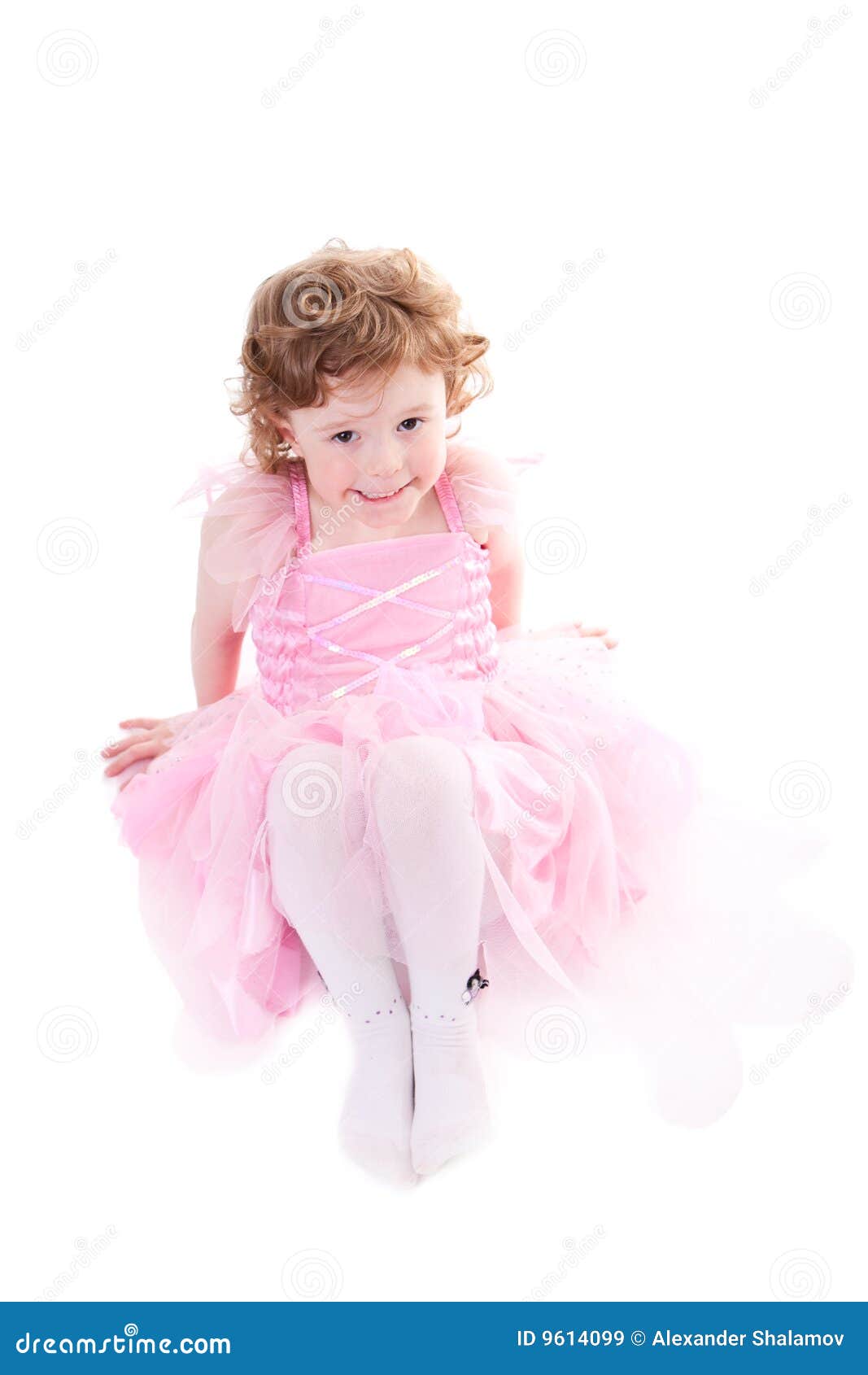 Cute curly haired girl in little fairy dress. Isolated on white