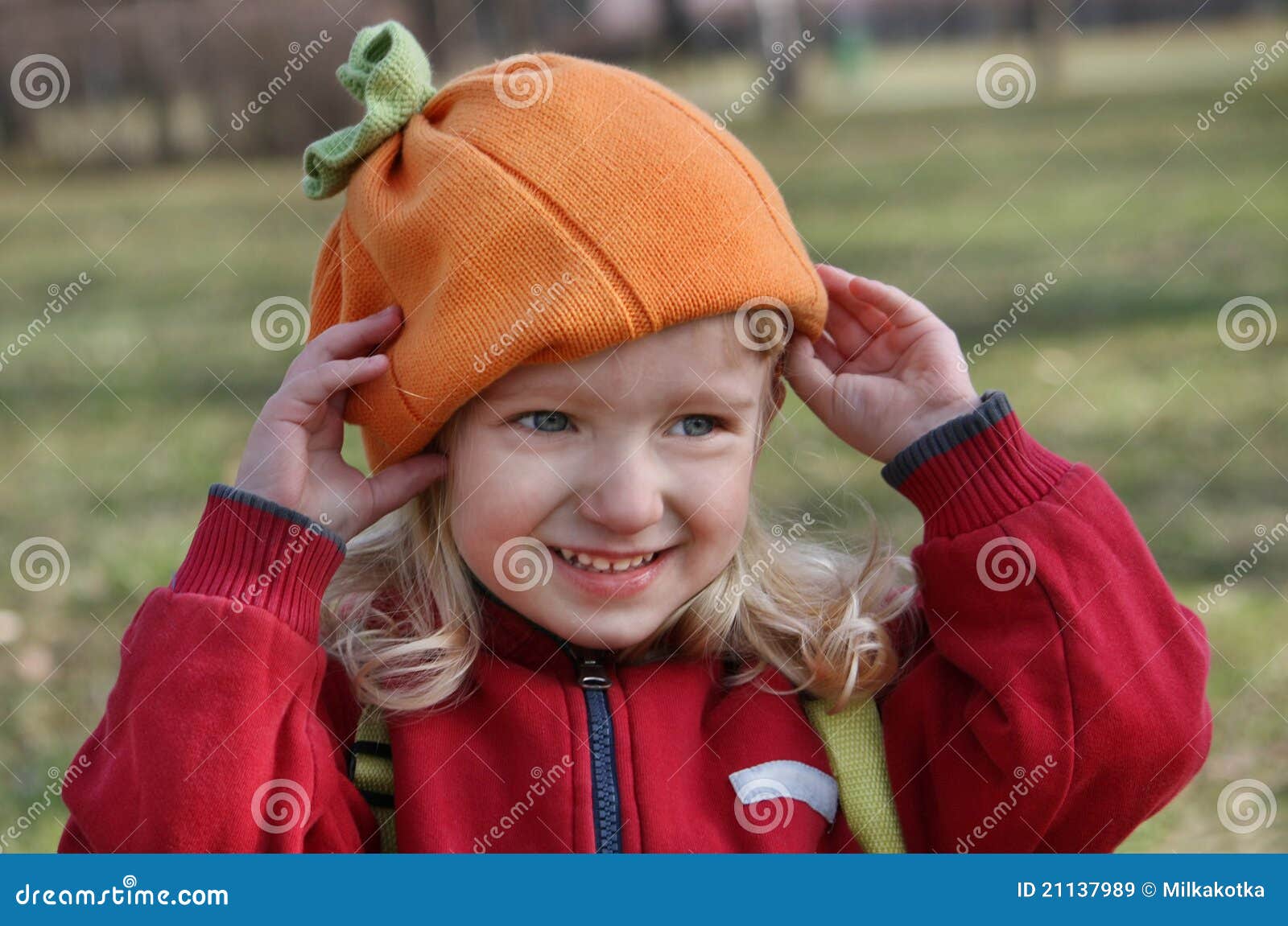 Little Girl Adjusts His Hat during Stock Image Image of blue, smile