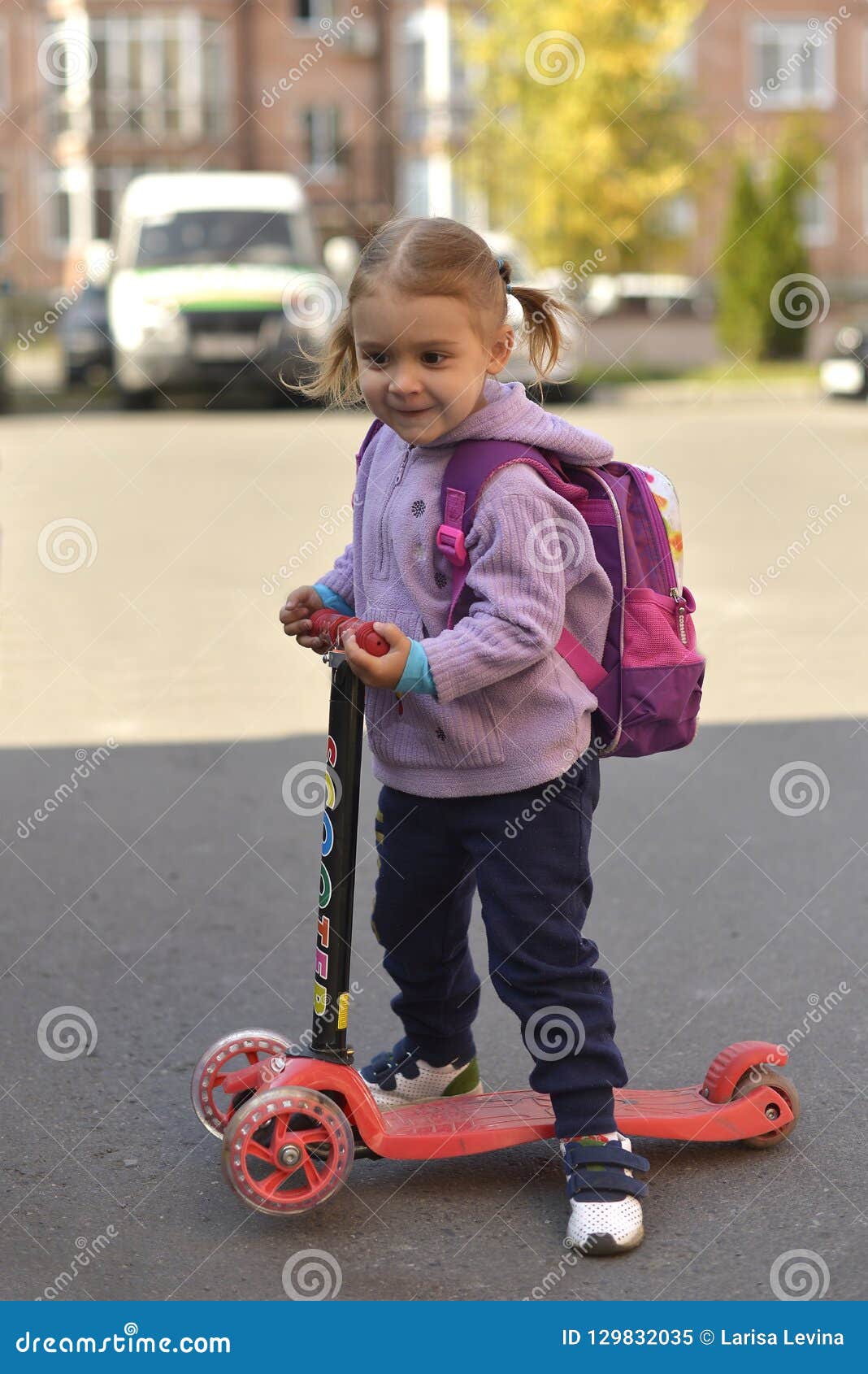 little girl on scooter