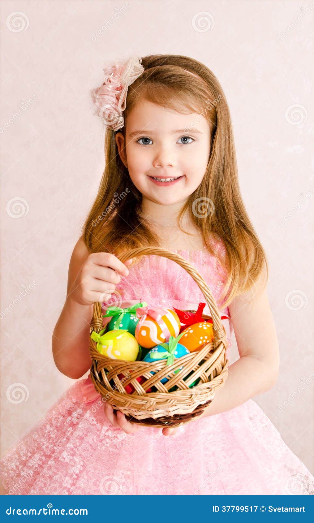 Little Girl with Basket Full of Colorful Easter Eggs Stock Image
