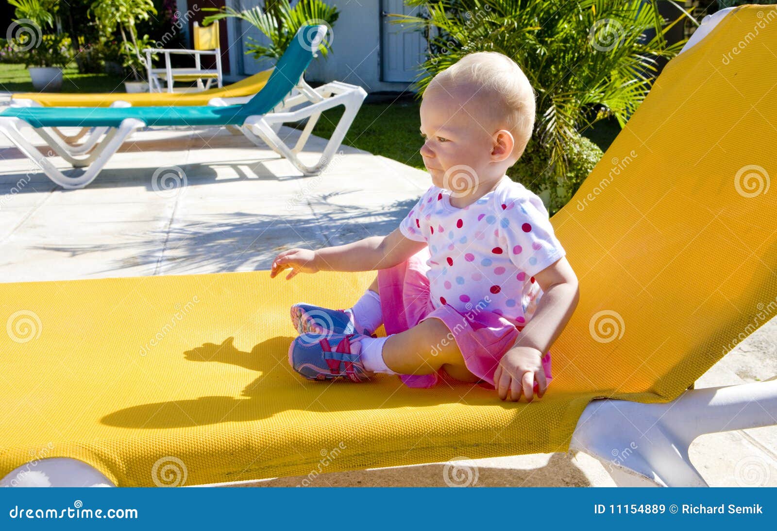 Little girl on beach chair stock image. Image of central 11154889