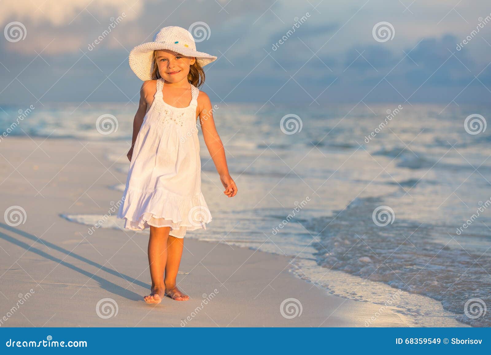 Little girl on the beach stock image. Image of cute, girl - 68359549