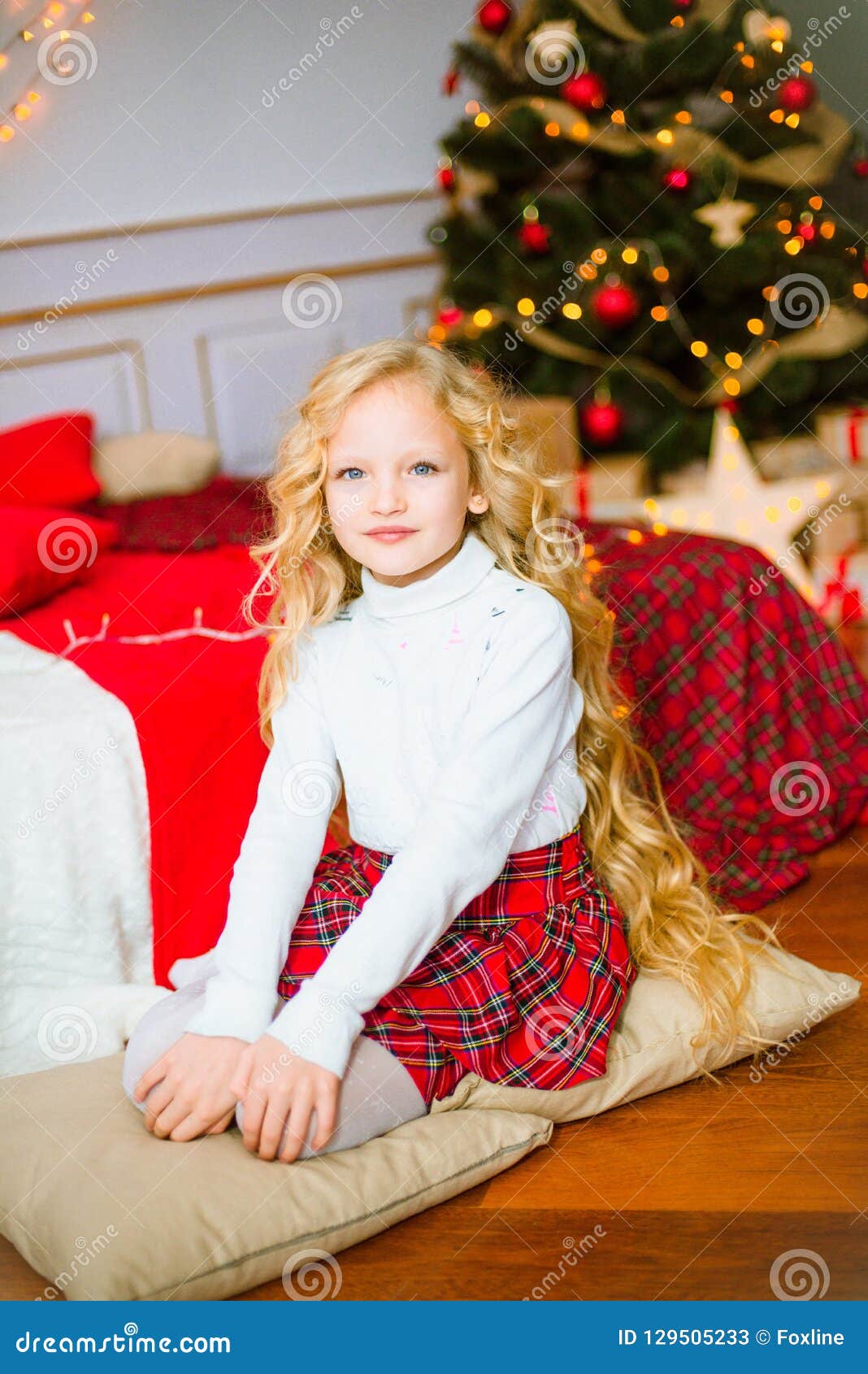 Little Girl With Blond Long Curly Hair At