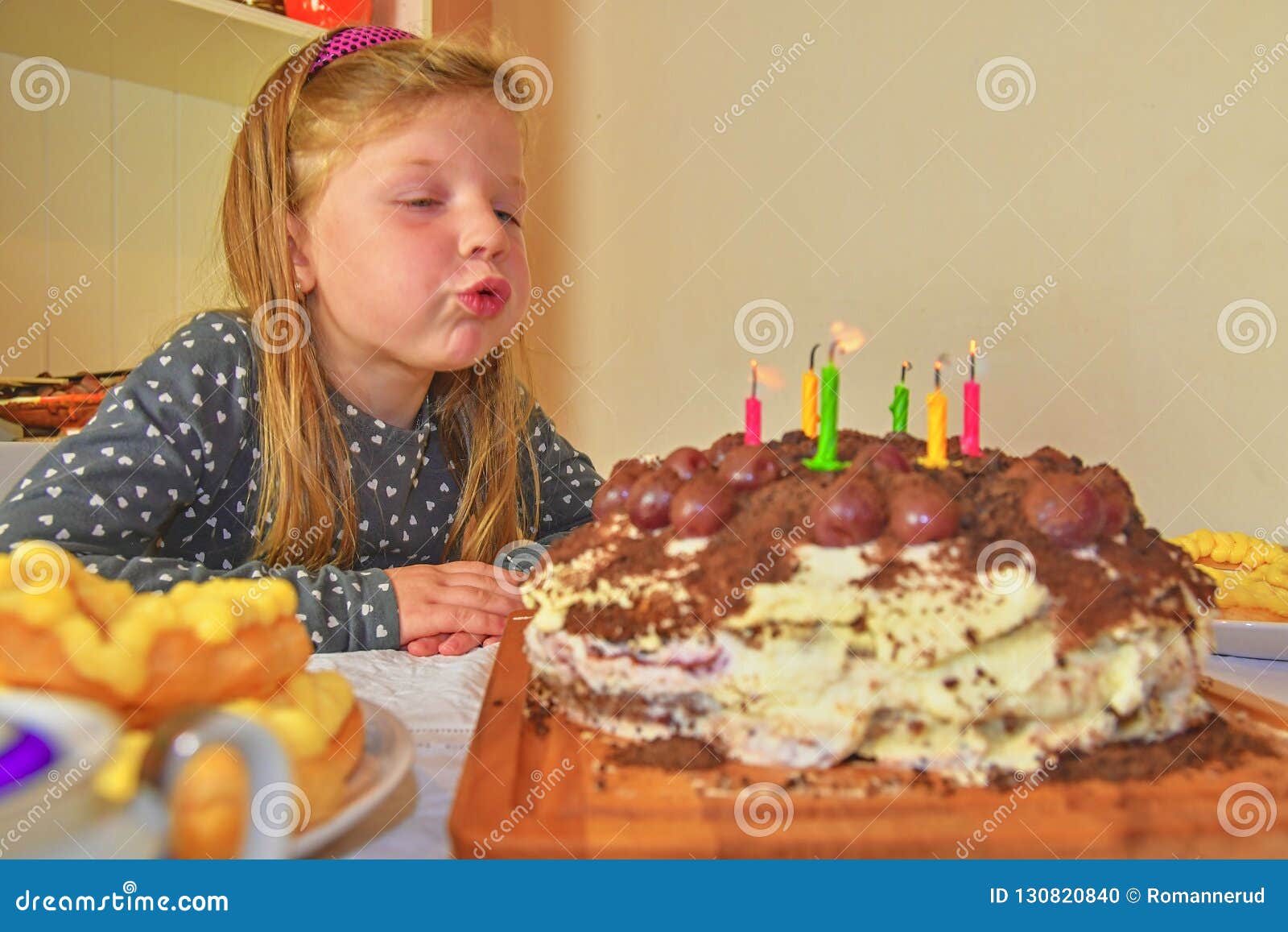 Little Girl Blowing Out Candles on Her Birthday Cake. Small Girl ...