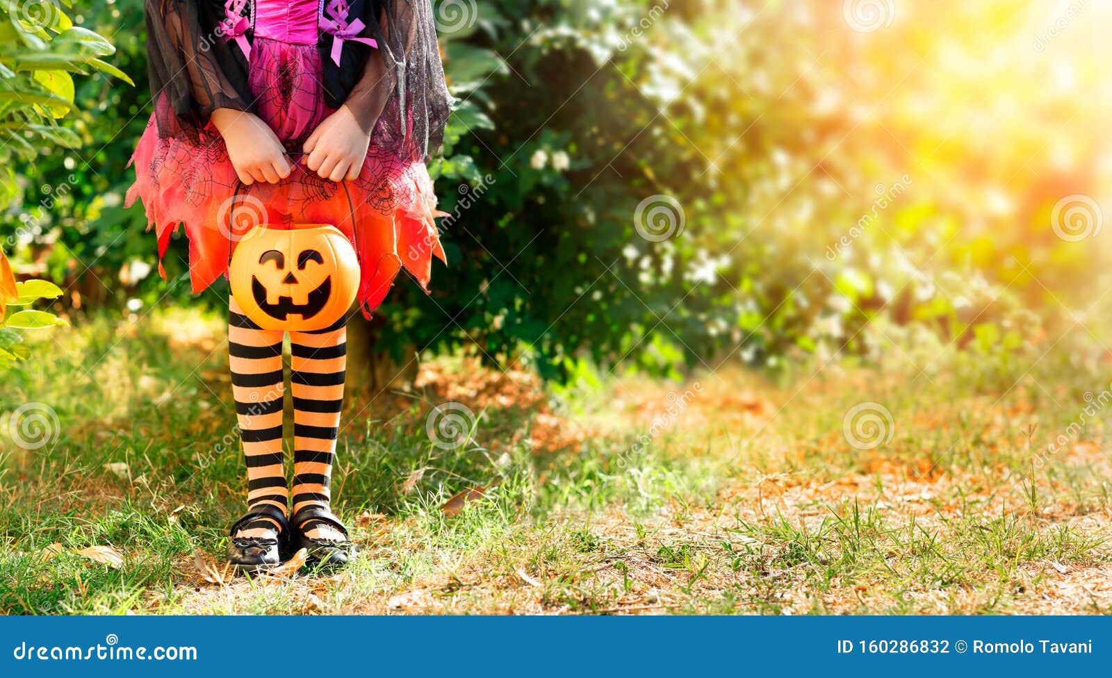 Little Girl with Candy Basket on Meadow Stock Photo - Image of ...