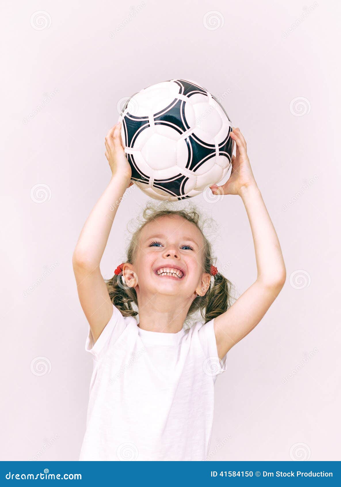 Little girl catches ball. stock photo. Image of fitness 41584150