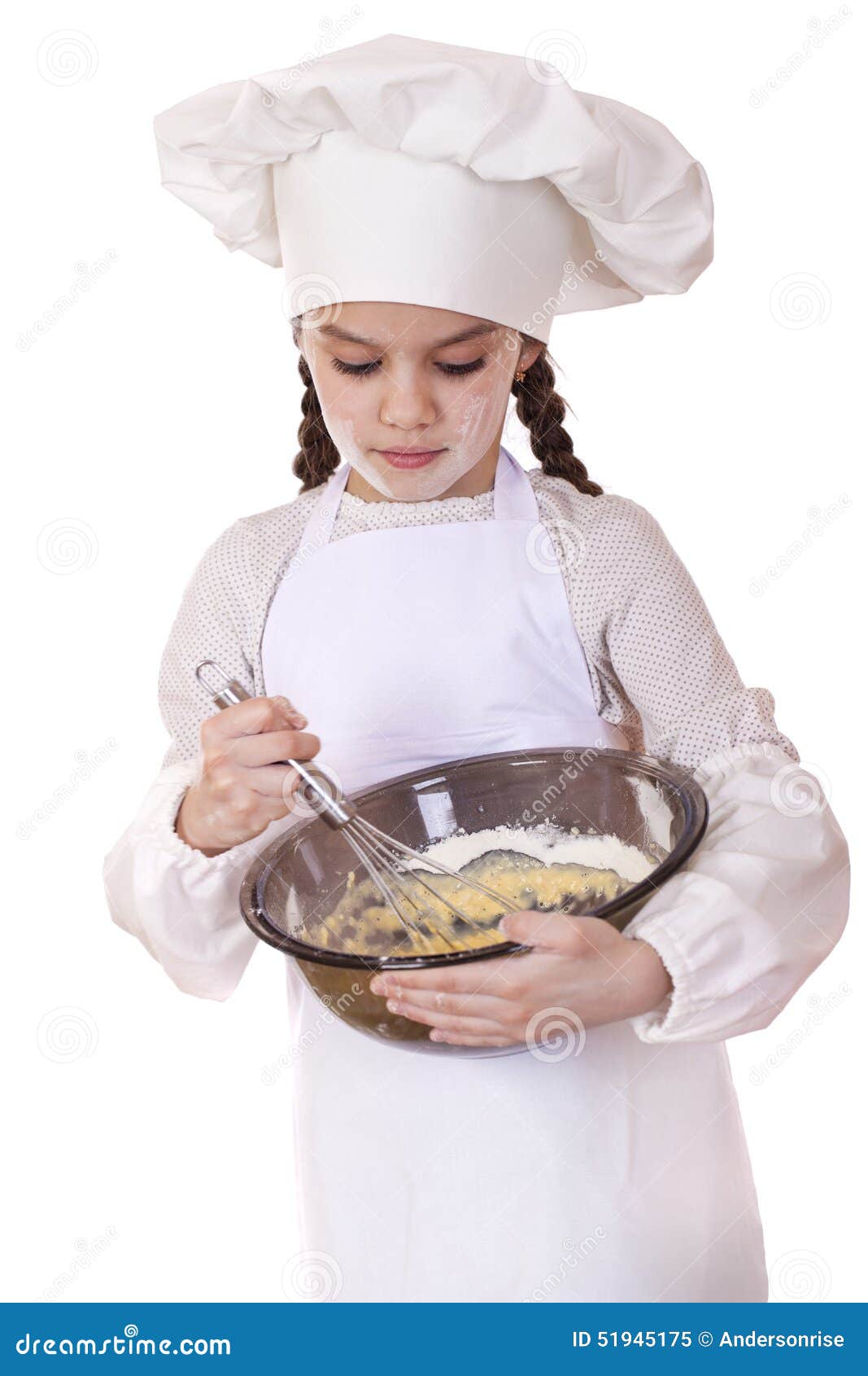 little girl cook whips whisk eggs in a large plate
