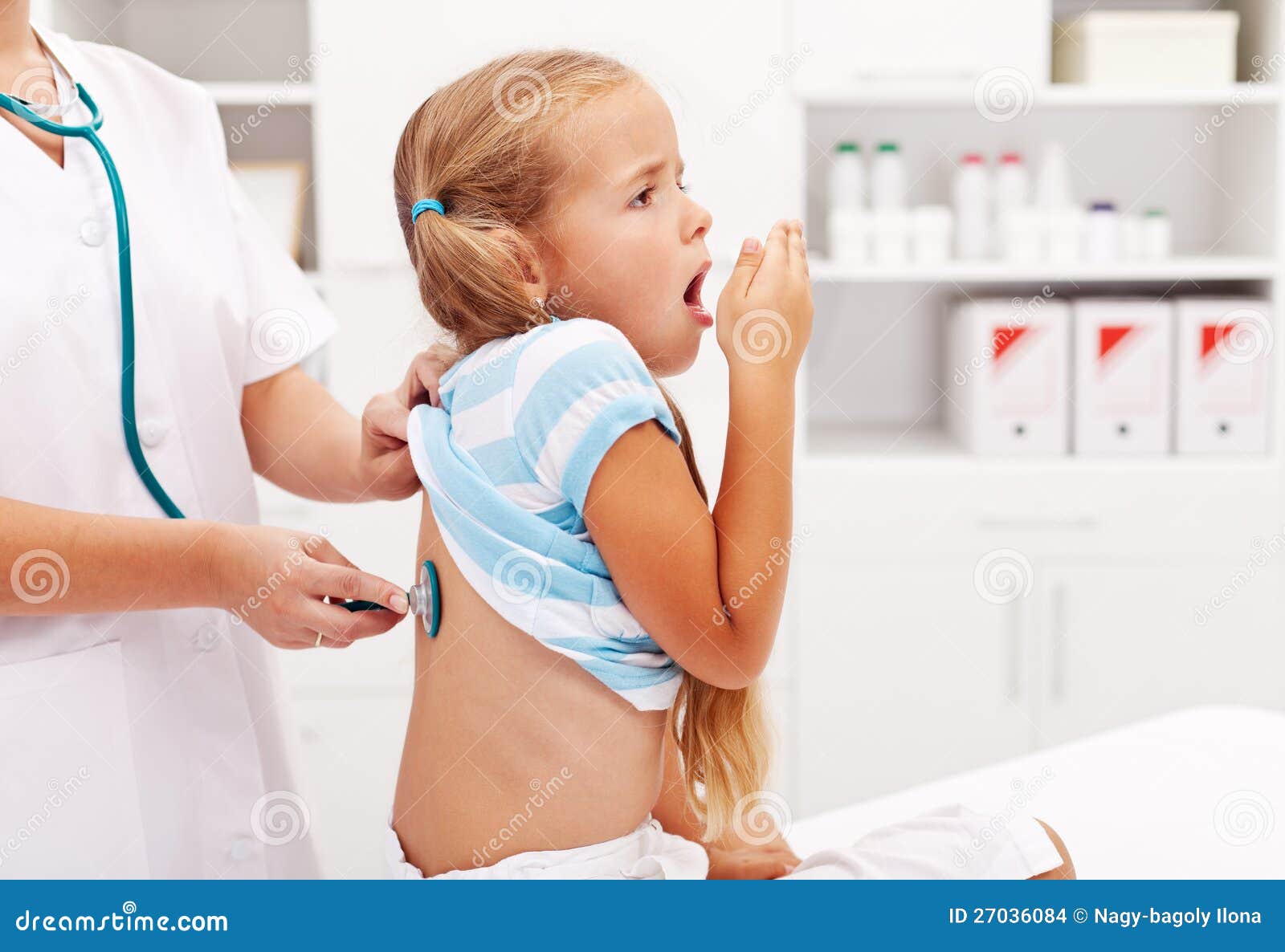 little girl coughing at the doctor