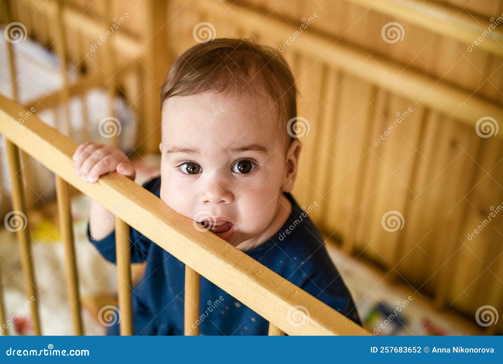 A little girl in a crib. stock photo. Image of concepts 257683652