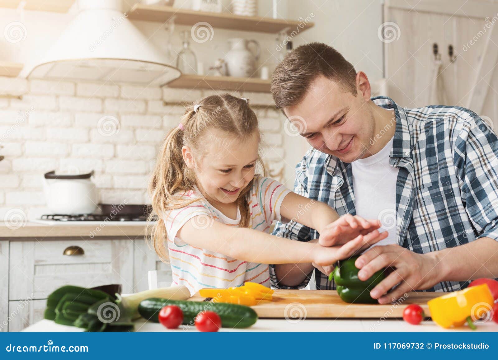 Little Girl and Dad Having Fun while Cooking in Kitchen Stock Photo ...